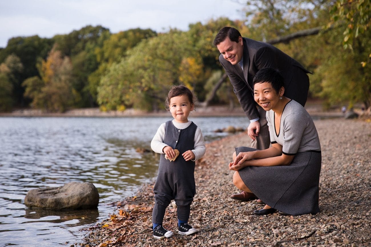 A documentary photograph of a family hanging out during their Jamaica Pond Family Photo Session