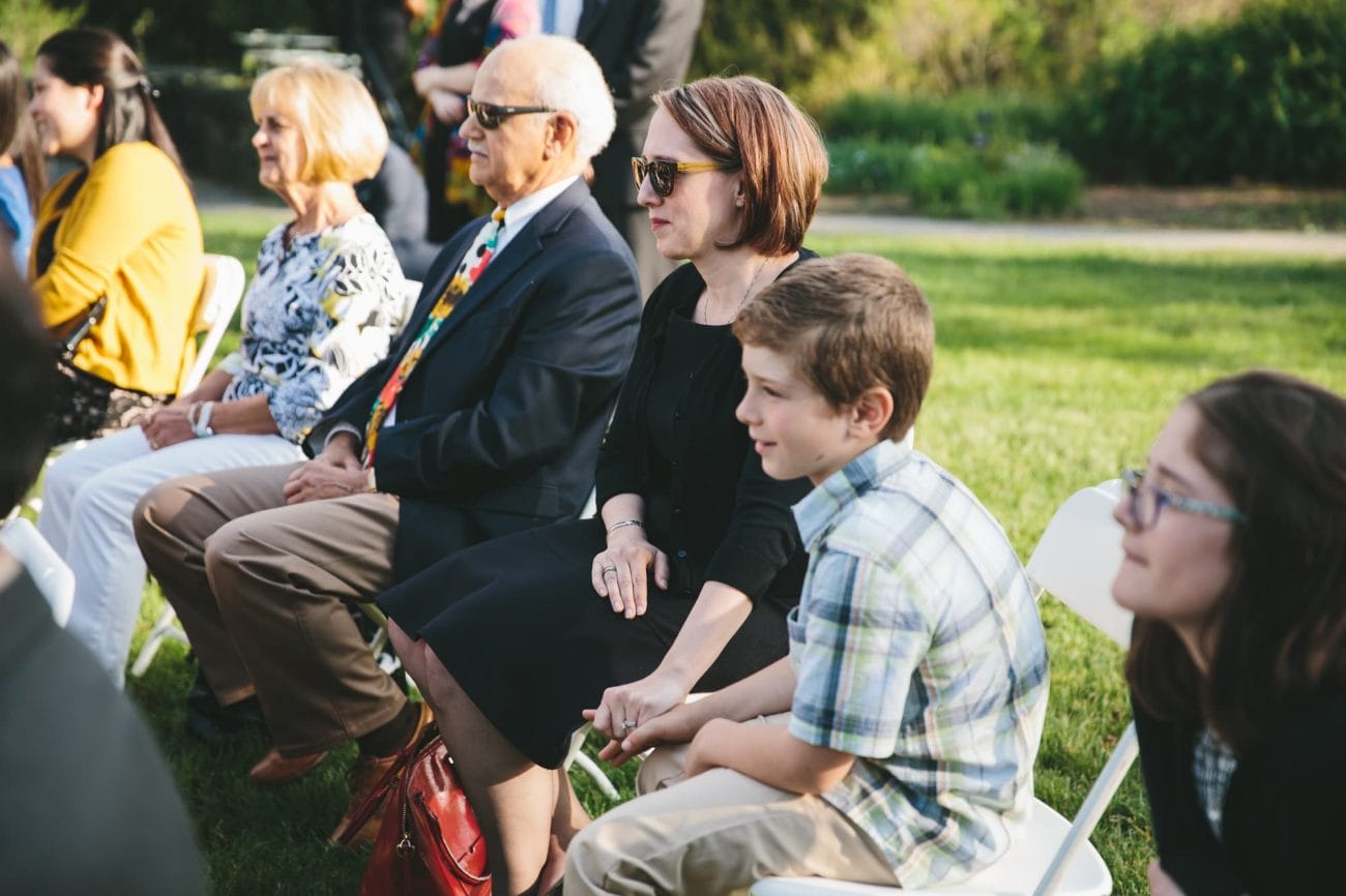 A documentary photograph of guest watching a Tower Hill Wedding ceremony in Boylston, Massachusetts