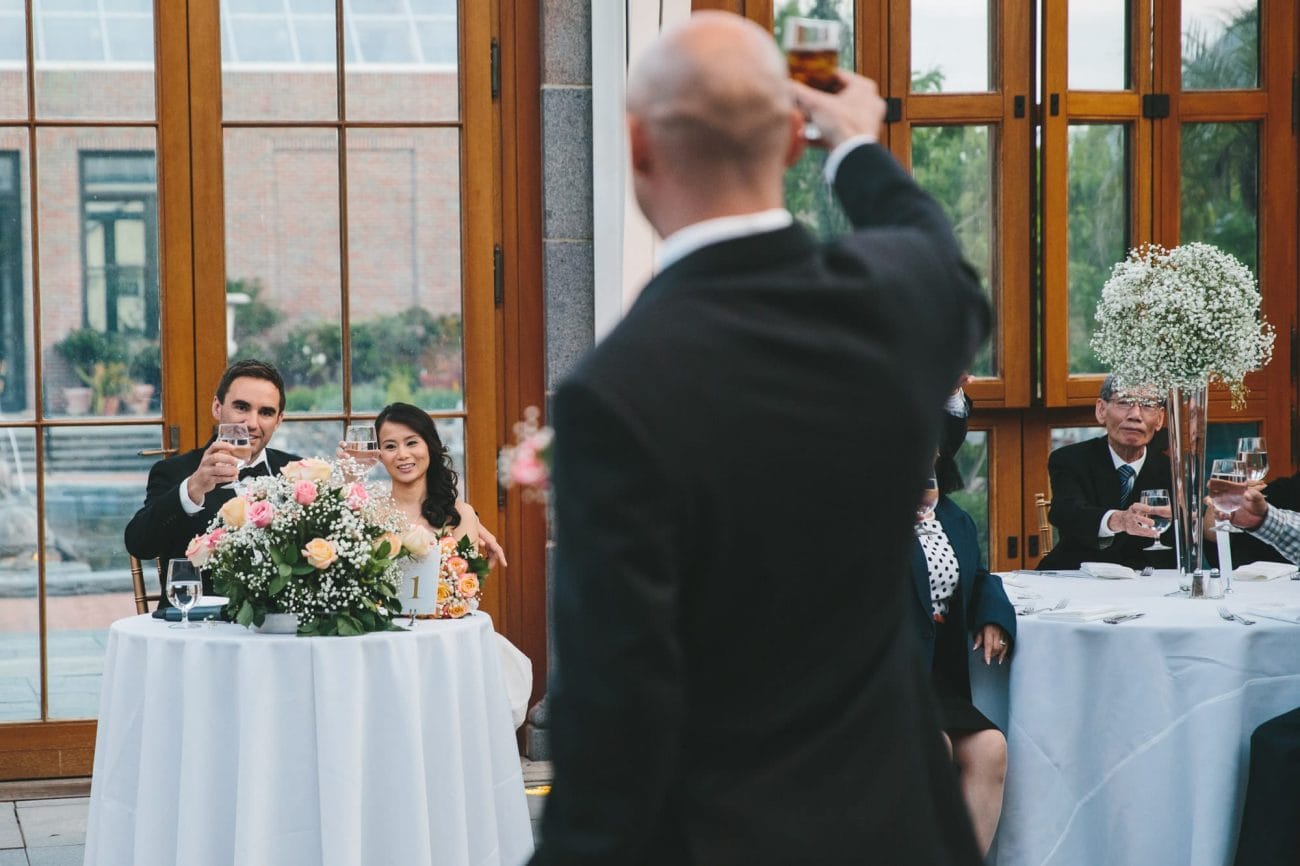 A documentary photograph of the best man toasting the bride and groom during a Tower Hill Wedding in Boylston, Massachusetts