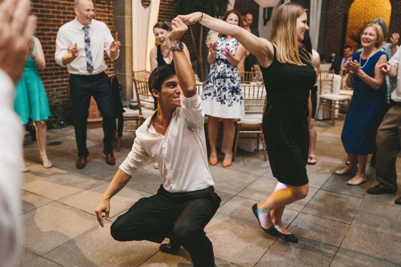 A documentary photograph of guests dancing during a tower hill wedding reception in Boylston, Massachusetts