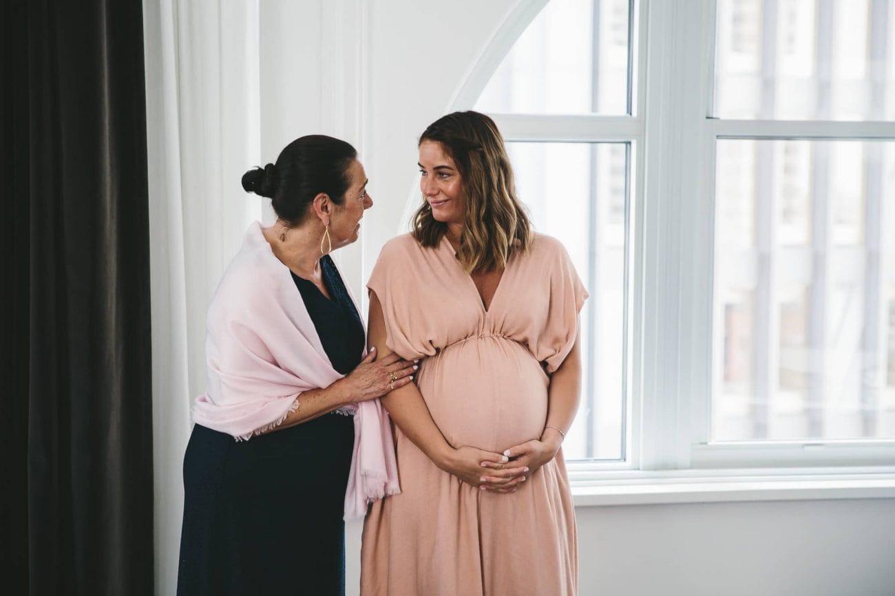 A documentary photograph of family talking before a State Room Wedding in Boston, Massachusetts