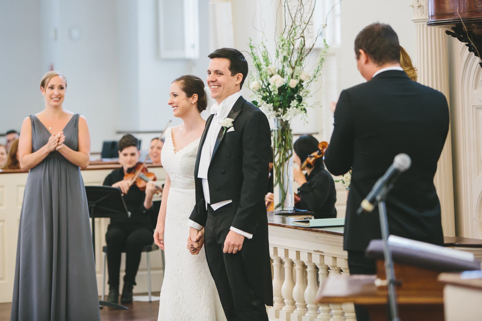 A documentary photograph of couple smiling after their old south meeting house wedding ceremony in Boston, Massachusetts