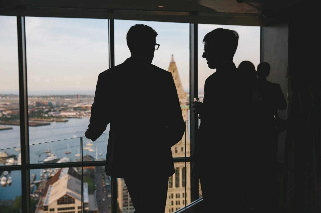 A documentary photograph of guest talking during an State Room Wedding reception