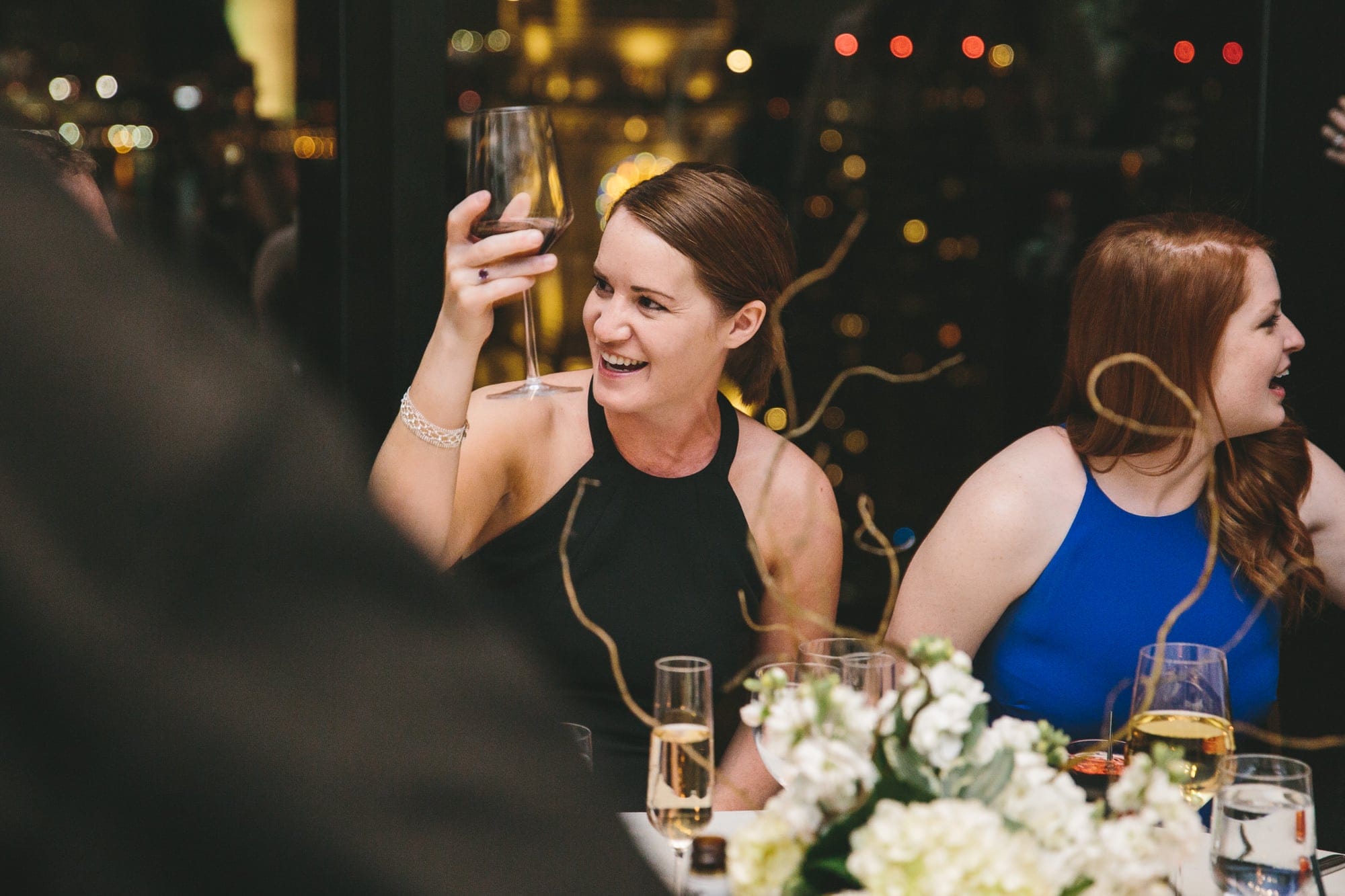 A documentary photograph of guests celebrating during a state room wedding reception