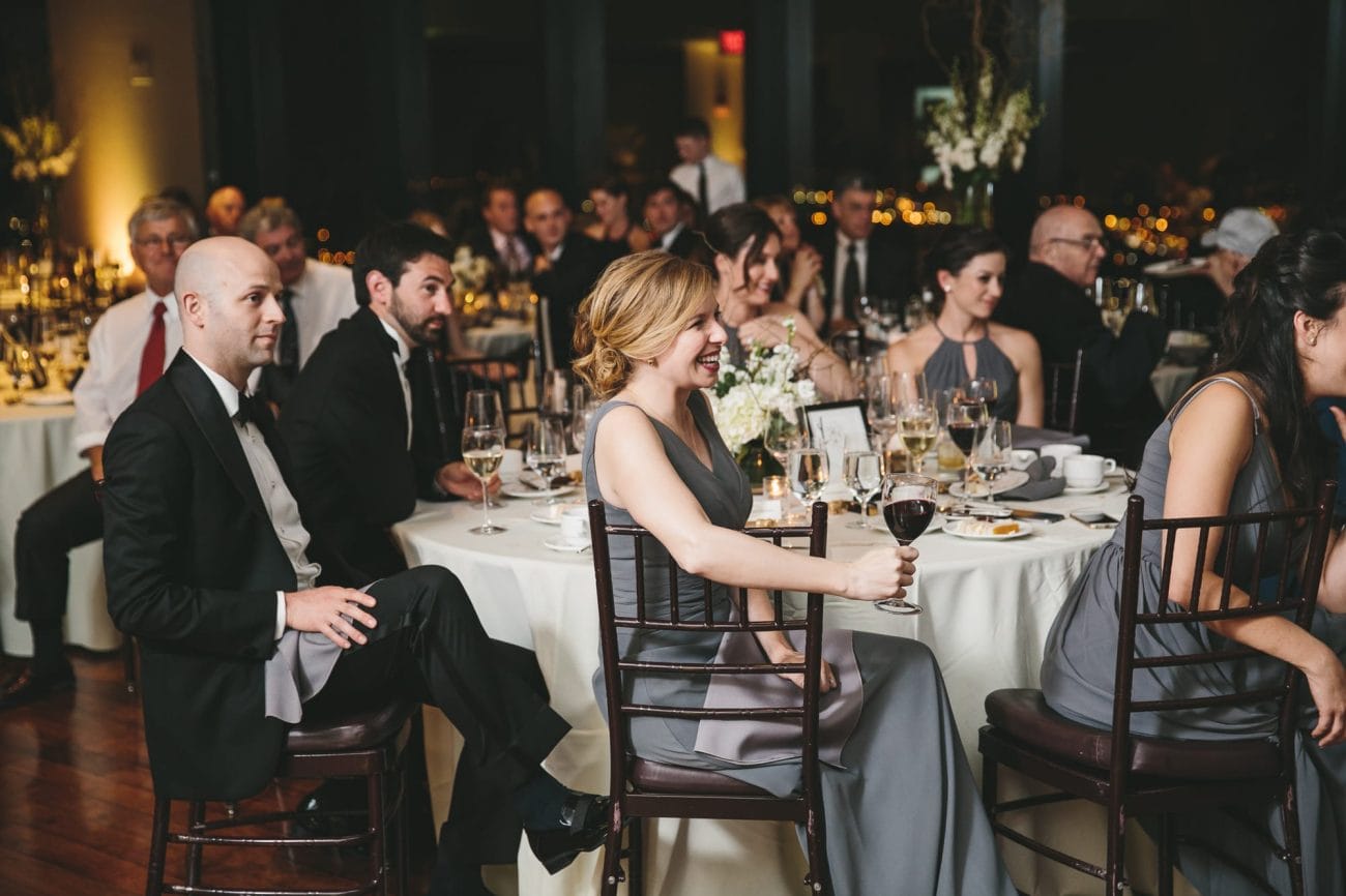 A documentary photograph of the wedding speeches at a State Room Wedding