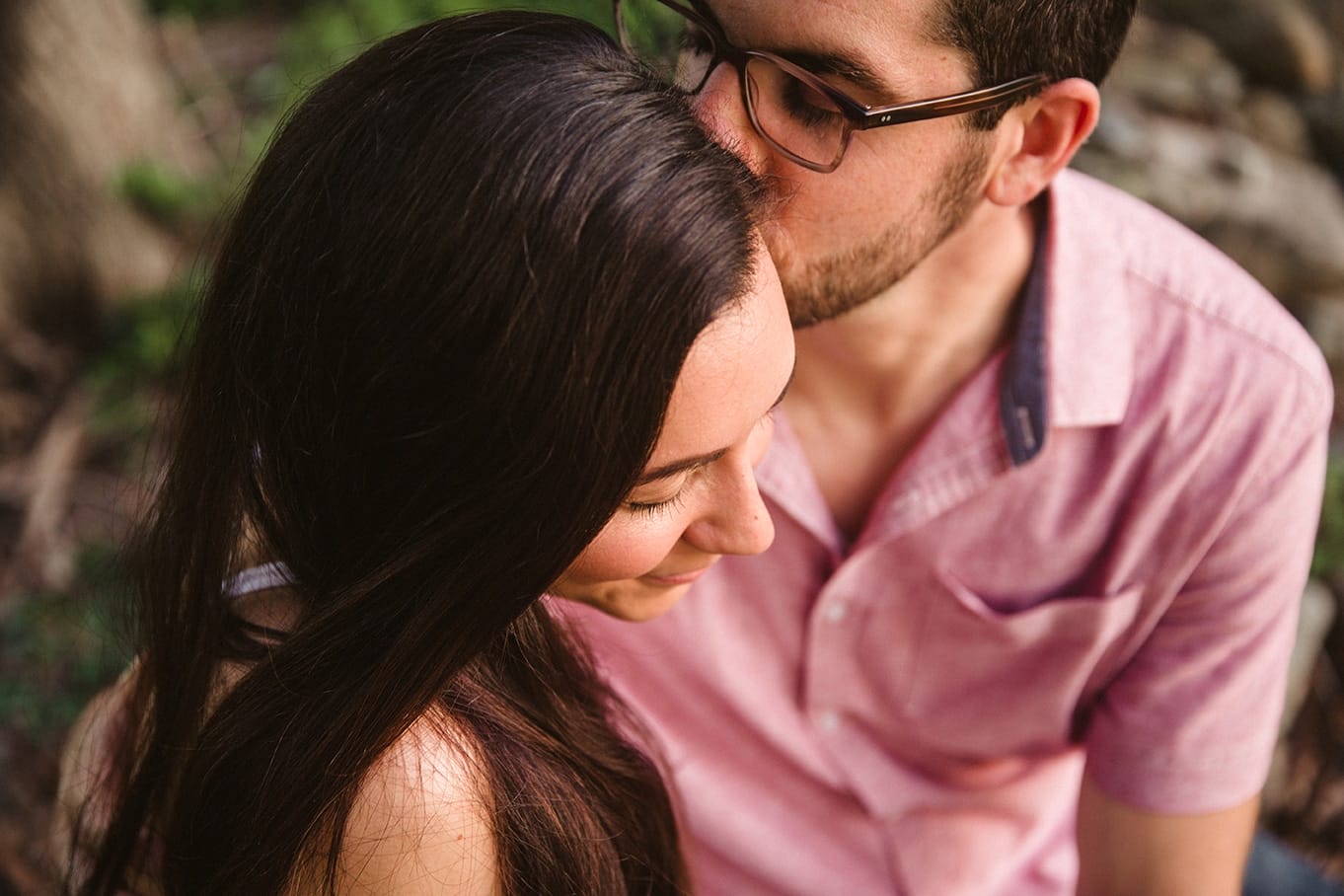 A documentary photograph of a couple kissing during their World's End Engagement Session in Hingham, Massachusetts