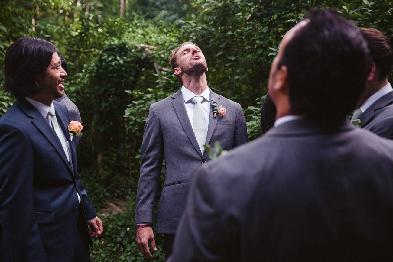 A documentary photograph of a groomsmen howling before a plimoth plantation wedding in plymouth, massachusetts