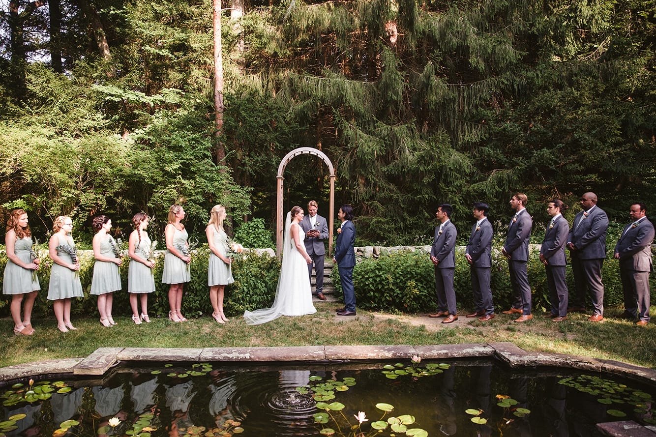 A documentary photograph of a bride and groom during their plimoth plantation wedding ceremony in plymouth, massachusetts