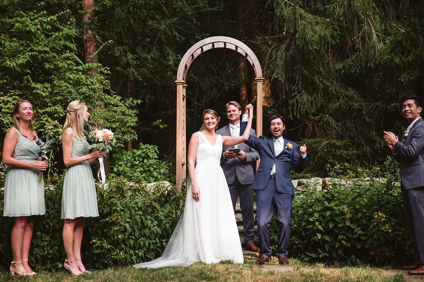 A documentary photograph of a bride and groom after their pronounced husband and wife during a plimoth plantation wedding in plymouth, massachusetts
