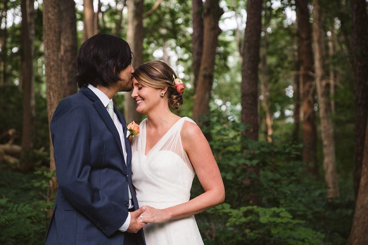 A portrait of a bride and groom kissing after their plimoth plantation wedding ceremony in plymouth, massachusetts