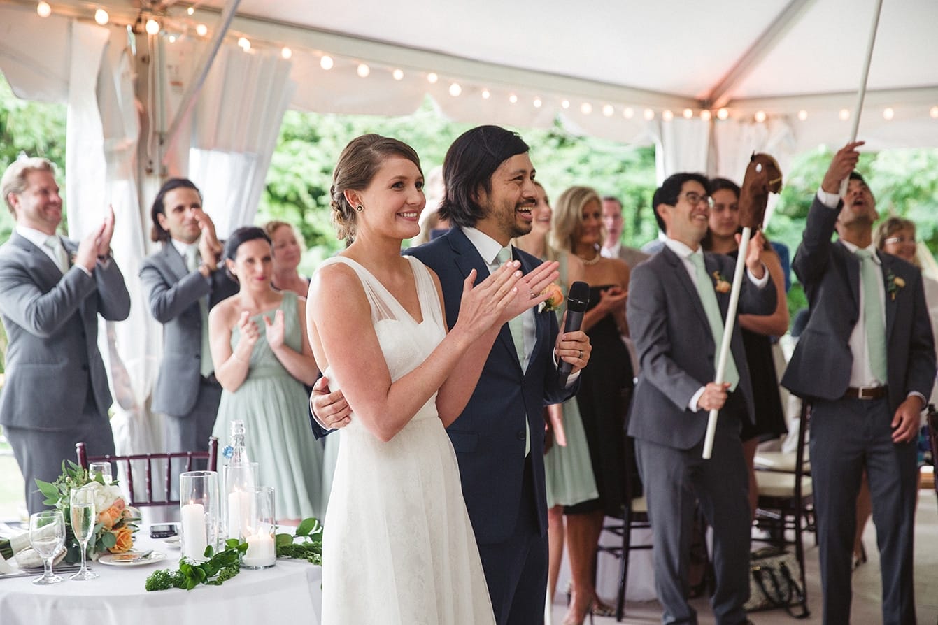 A documentary photograph of a bride and groom thanking their guests during their plimoth plantation wedding ceremony in plymouth, massachusetts