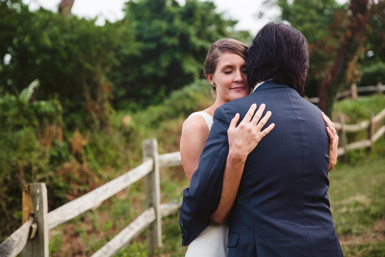 A portrait of a bride and groom hugging during their plimoth plantation wedding in plymouth, massachusetts