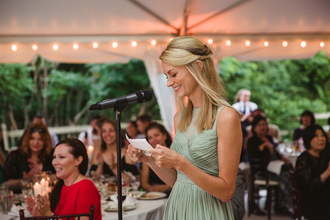 A documentary photograph of a bridesmaids giving a toast during a plimoth plantation wedding in plymouth, massachusetts