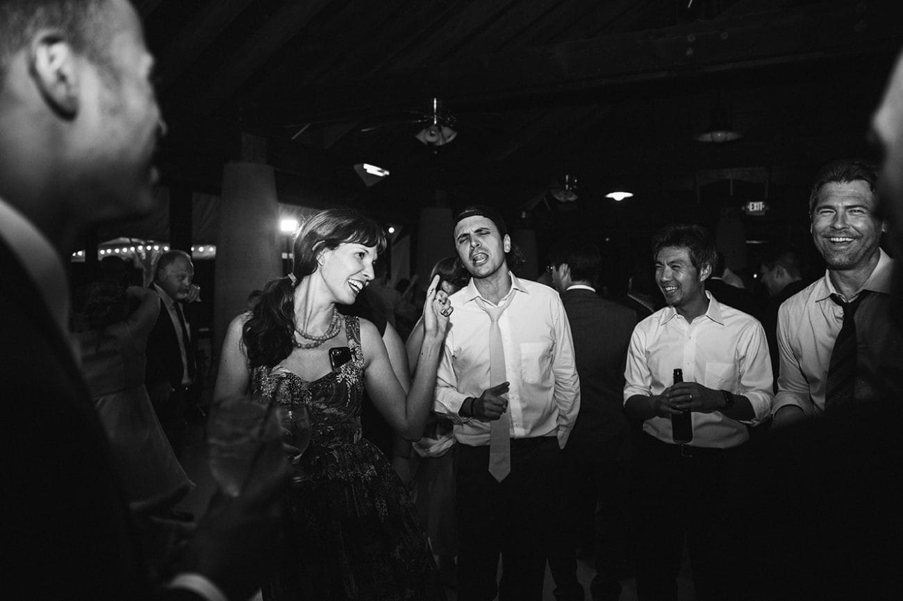 A documentary photograph of guests dancing during a plimoth plantation wedding in plymouth, massachusetts