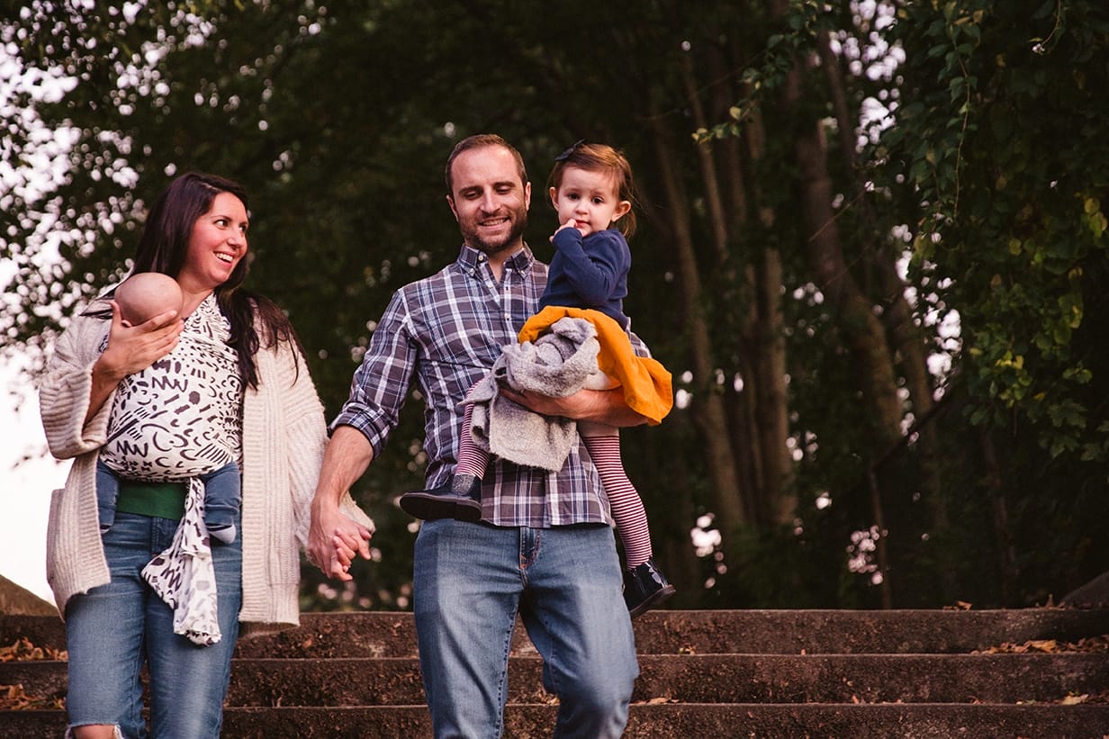 A documentary photograph of a family leaving the playground during a family lifestyle session in Boston, Massachusetts