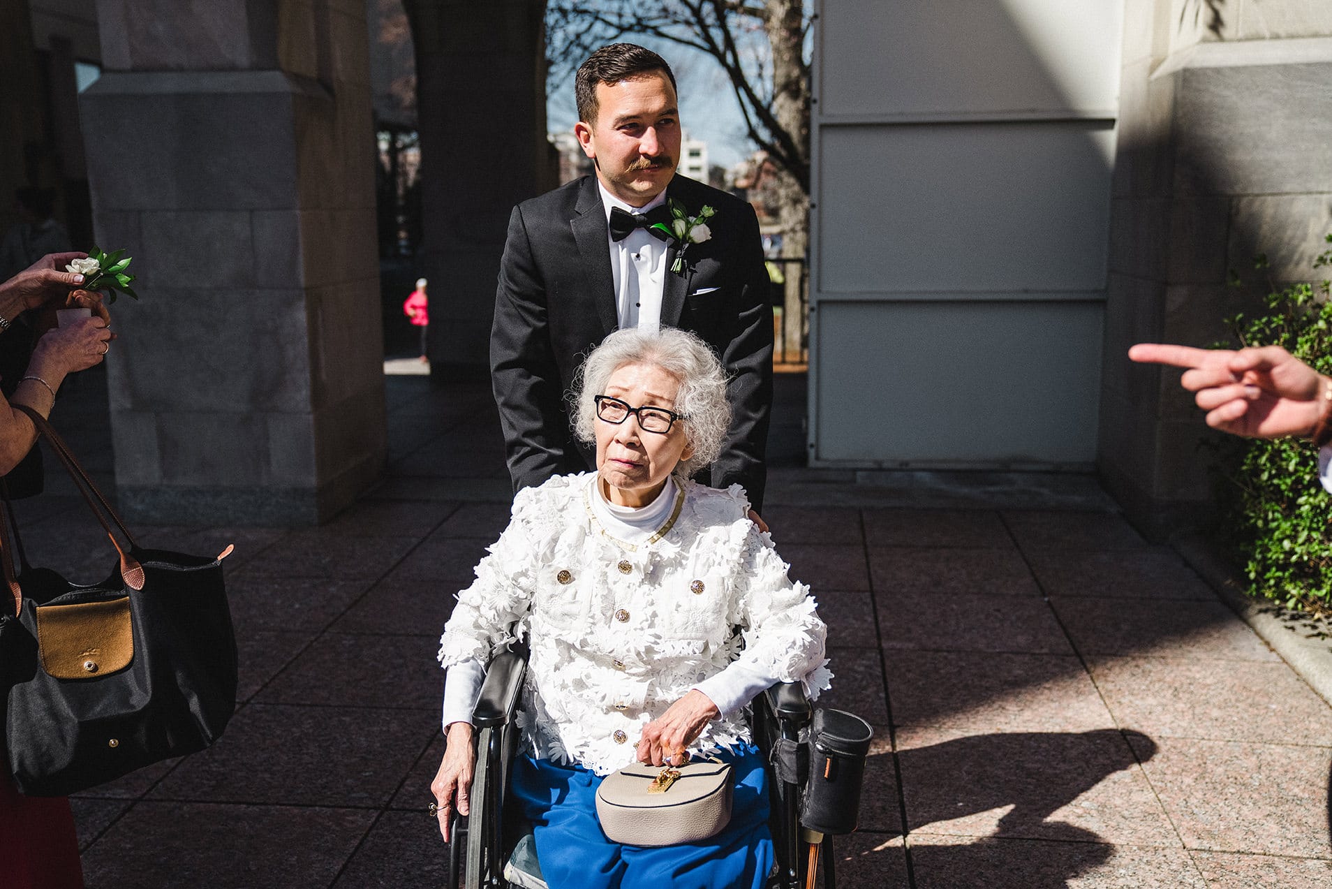 A documentary photograph of guests arriving to the ceremony of a Fairmont Copley Wedding in Boston