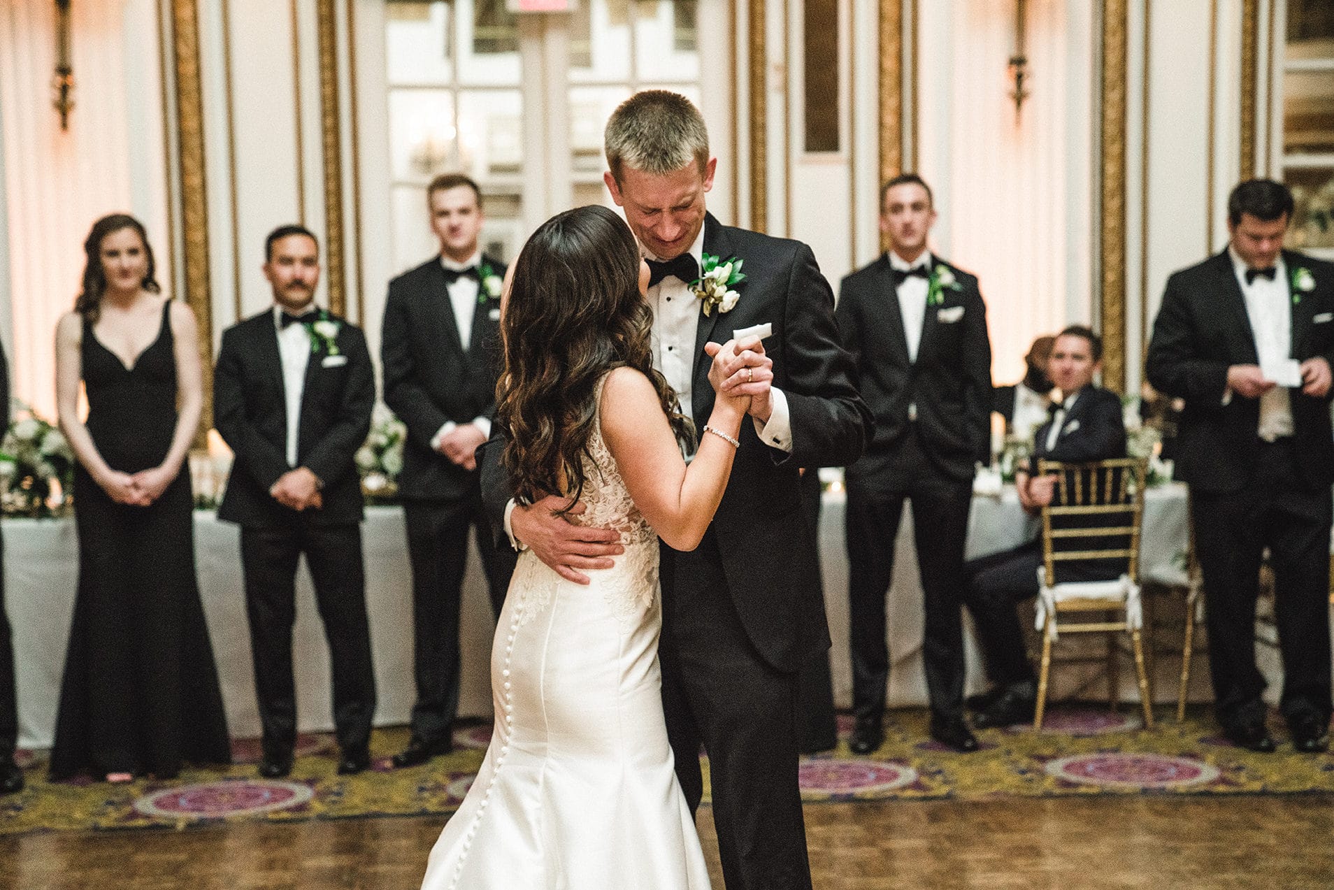 A documentary photograph of the bride and grooms first dance at their fairmont copley wedding