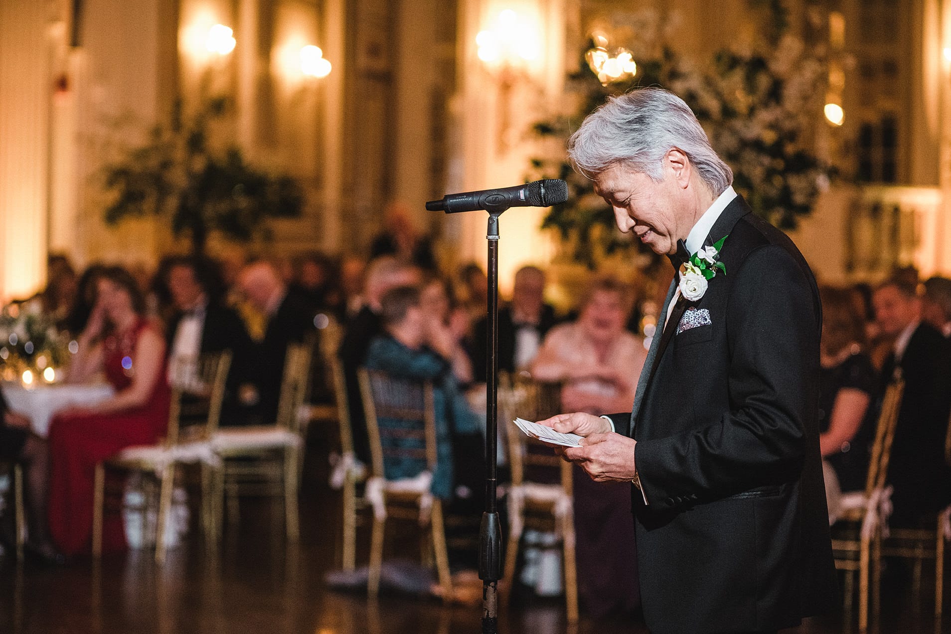 A documentary photograph of the funny and warm toasts at a fairmont copley wedding