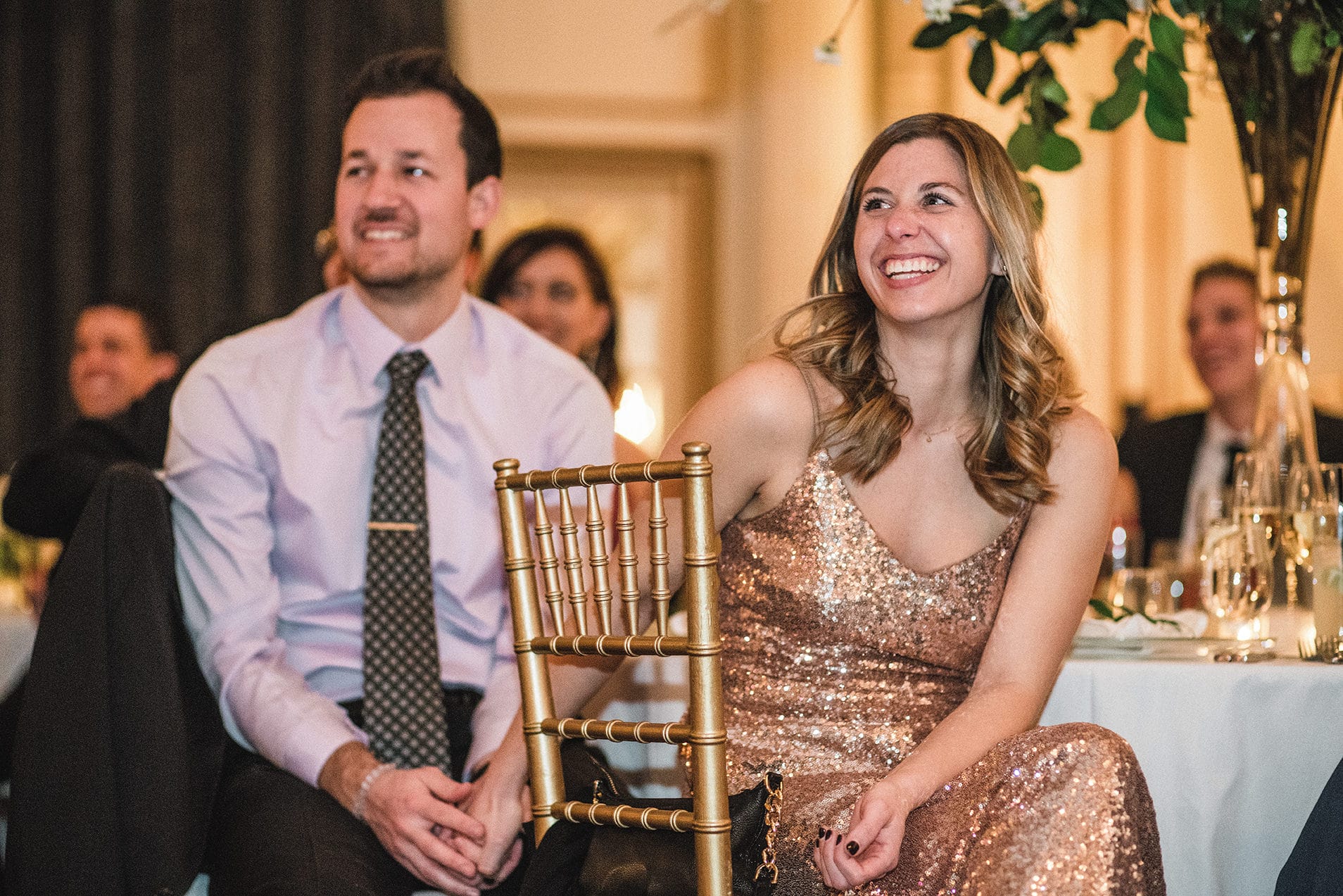 A documentary photograph of the funny and warm toasts at a fairmont copley wedding