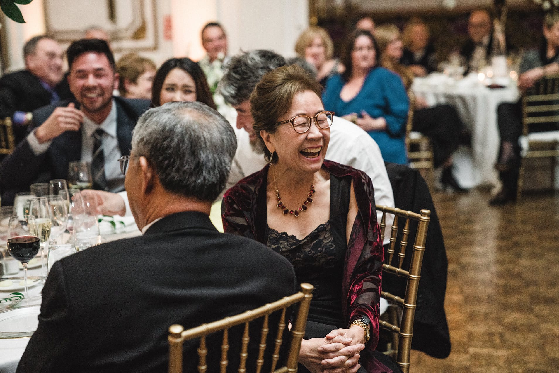 A documentary photograph of the funny and warm toasts at a fairmont copley wedding