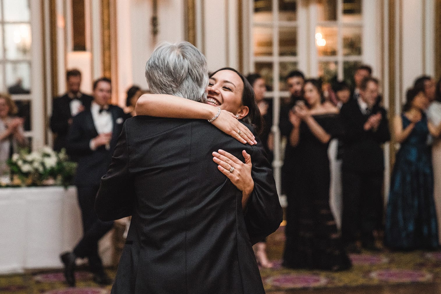 A documentary photograph of the father daughter dance at a fairmont copley wedding