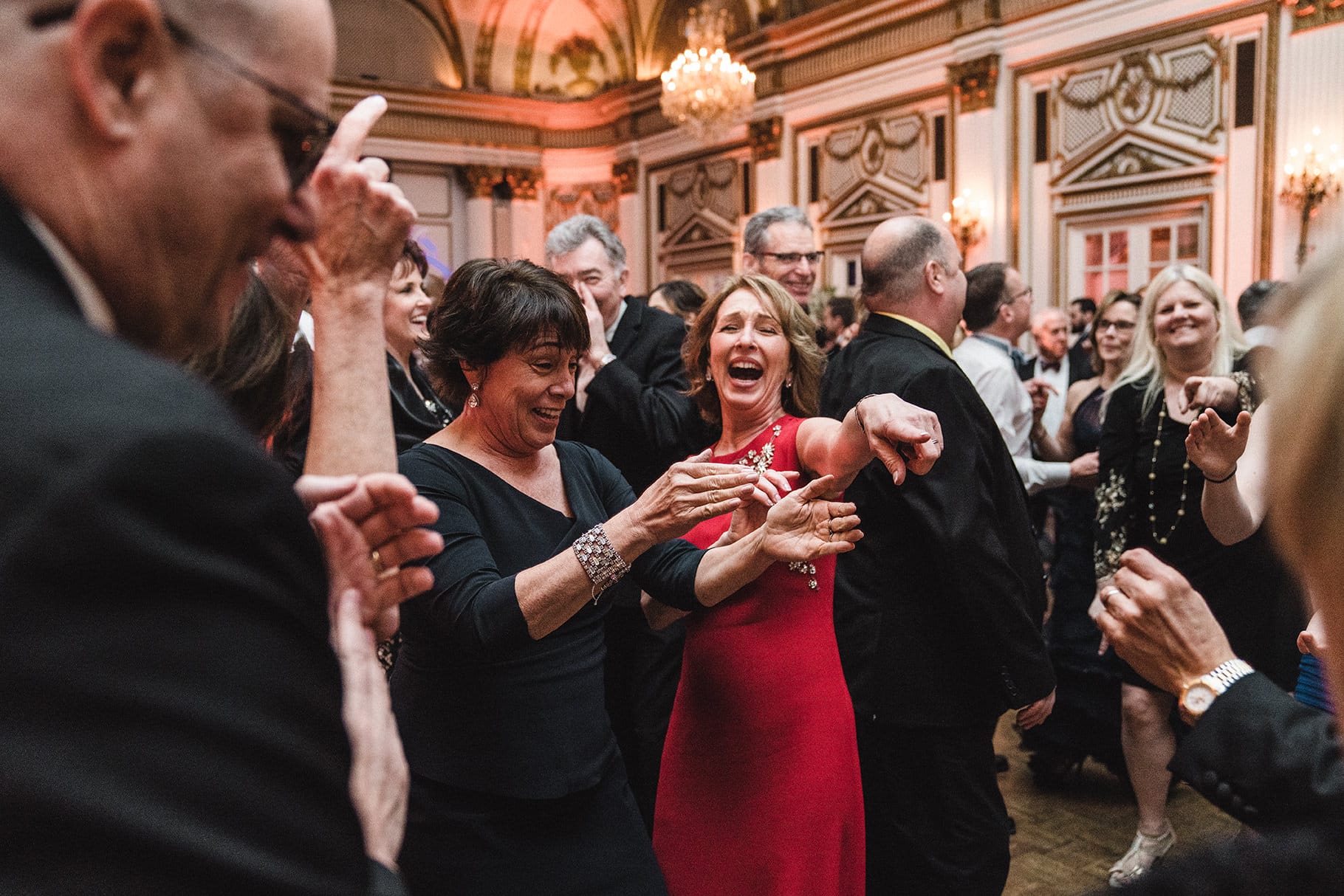 A documentary photograph of guests dancing at a fairmont copley wedding