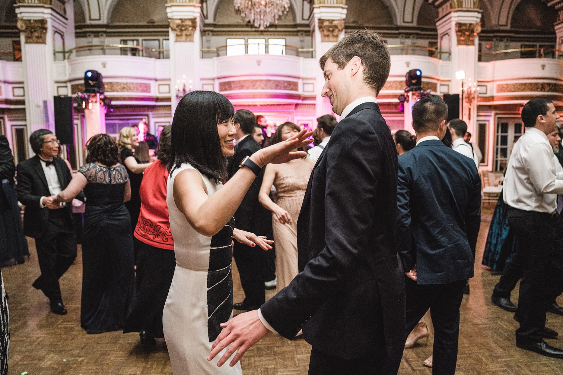 A documentary photograph of guests dancing at a fairmont copley wedding
