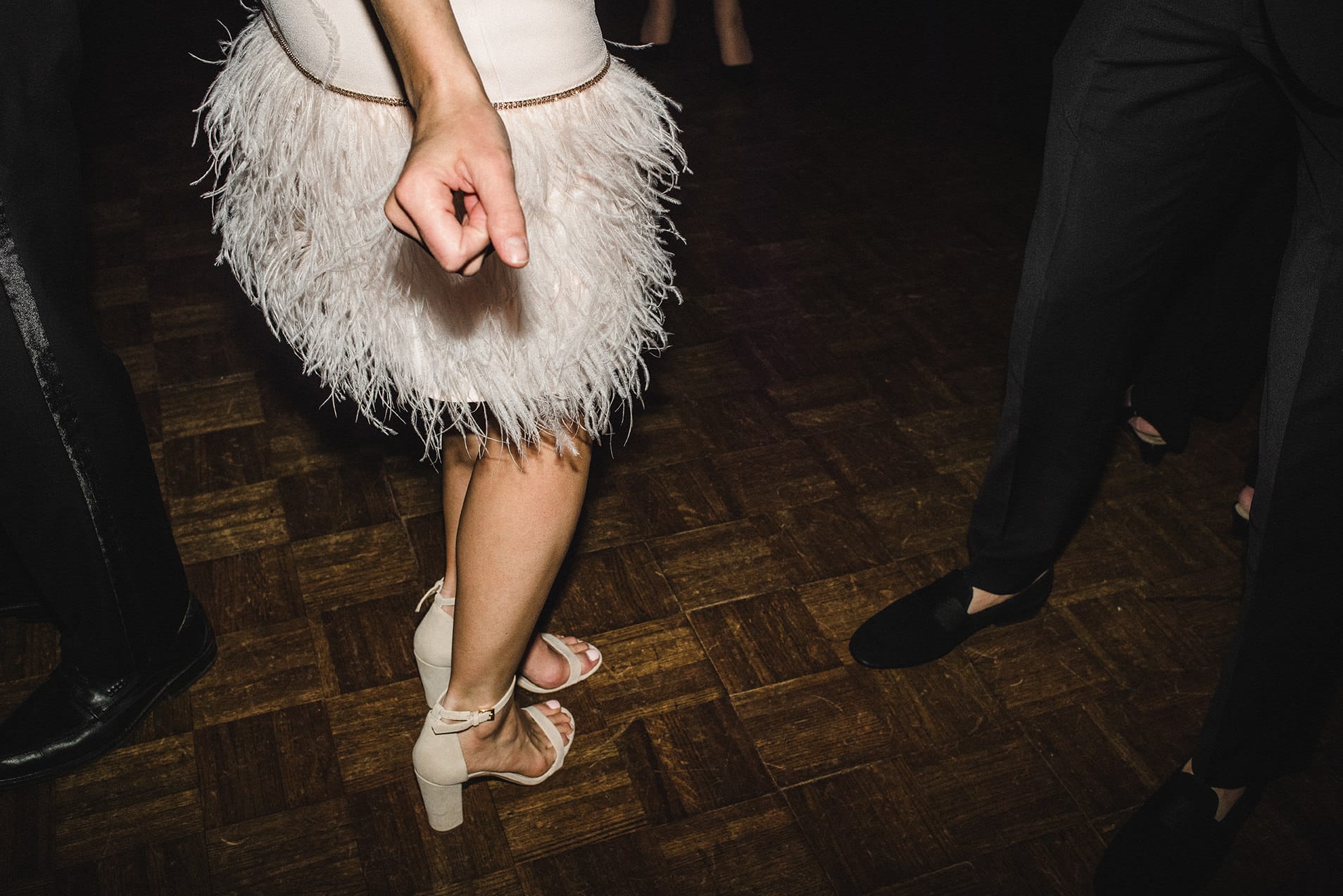 A documentary photograph of guests dancing at a fairmont copley wedding
