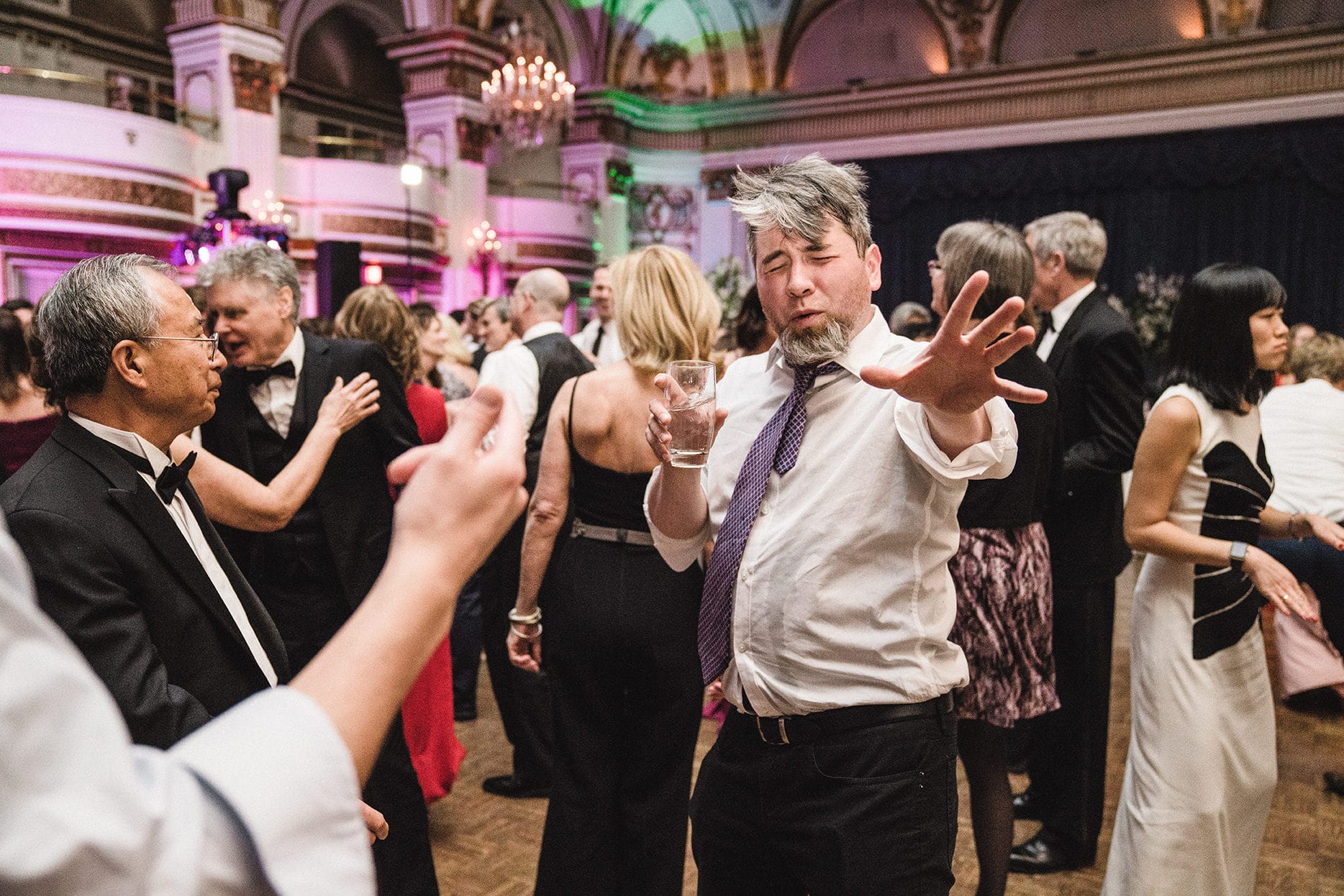 A documentary photograph of guests dancing at a fairmont copley wedding