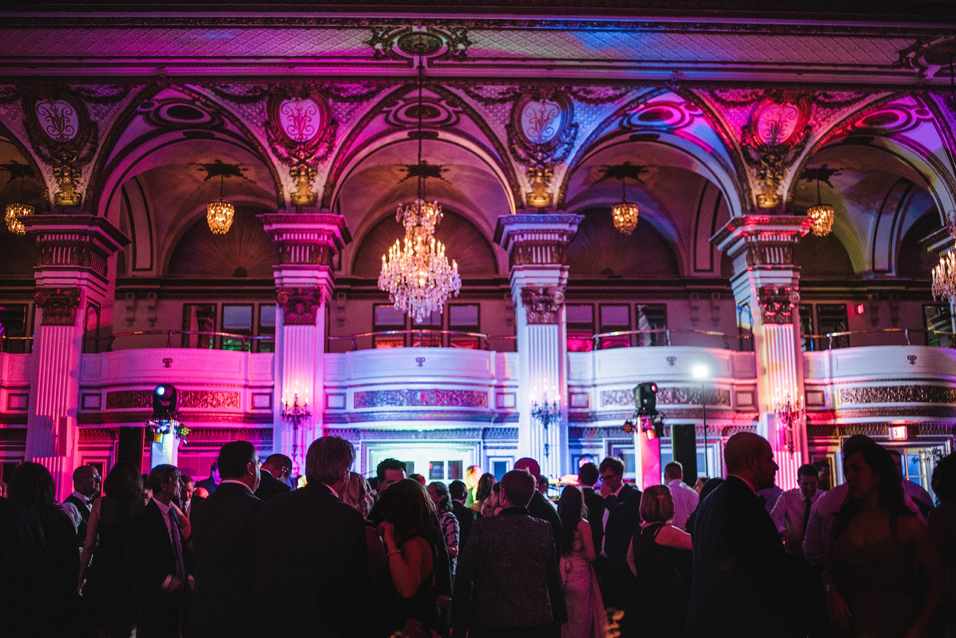A documentary photograph of guests dancing at a fairmont copley wedding