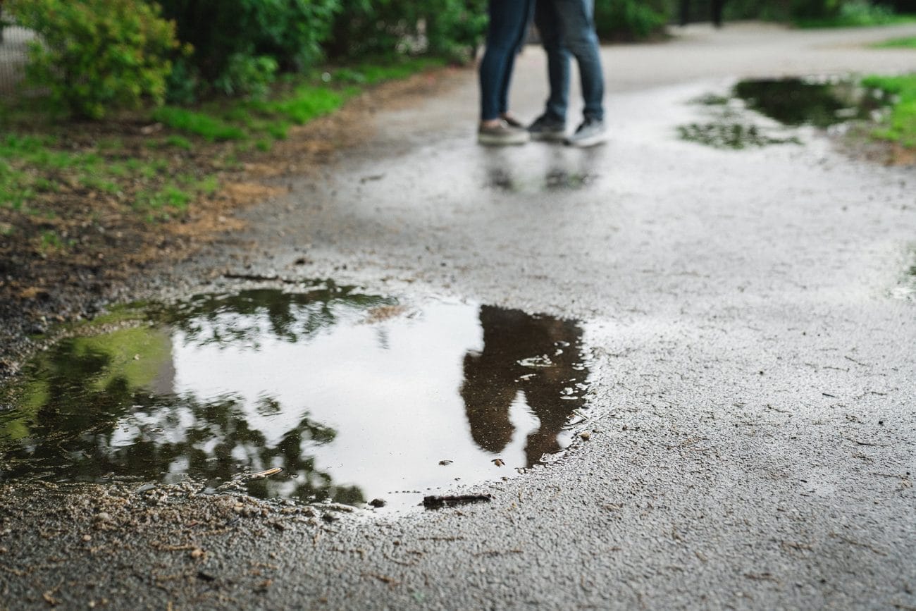 A artistic portrait of couple walking in the park during their South End Boston Engagement Session