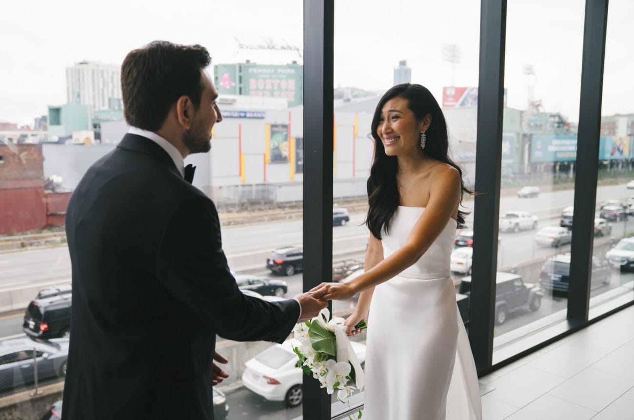 A best of Boston wedding photograph of a couple seeing each other during their first look at their Commonwealth Hotel Wedding