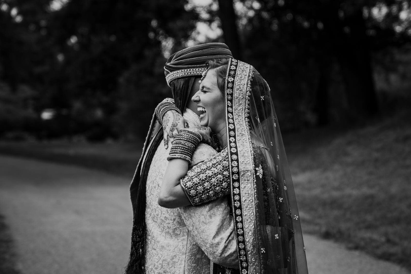 A best of Boston wedding photograph of a couple hugging during their first look 