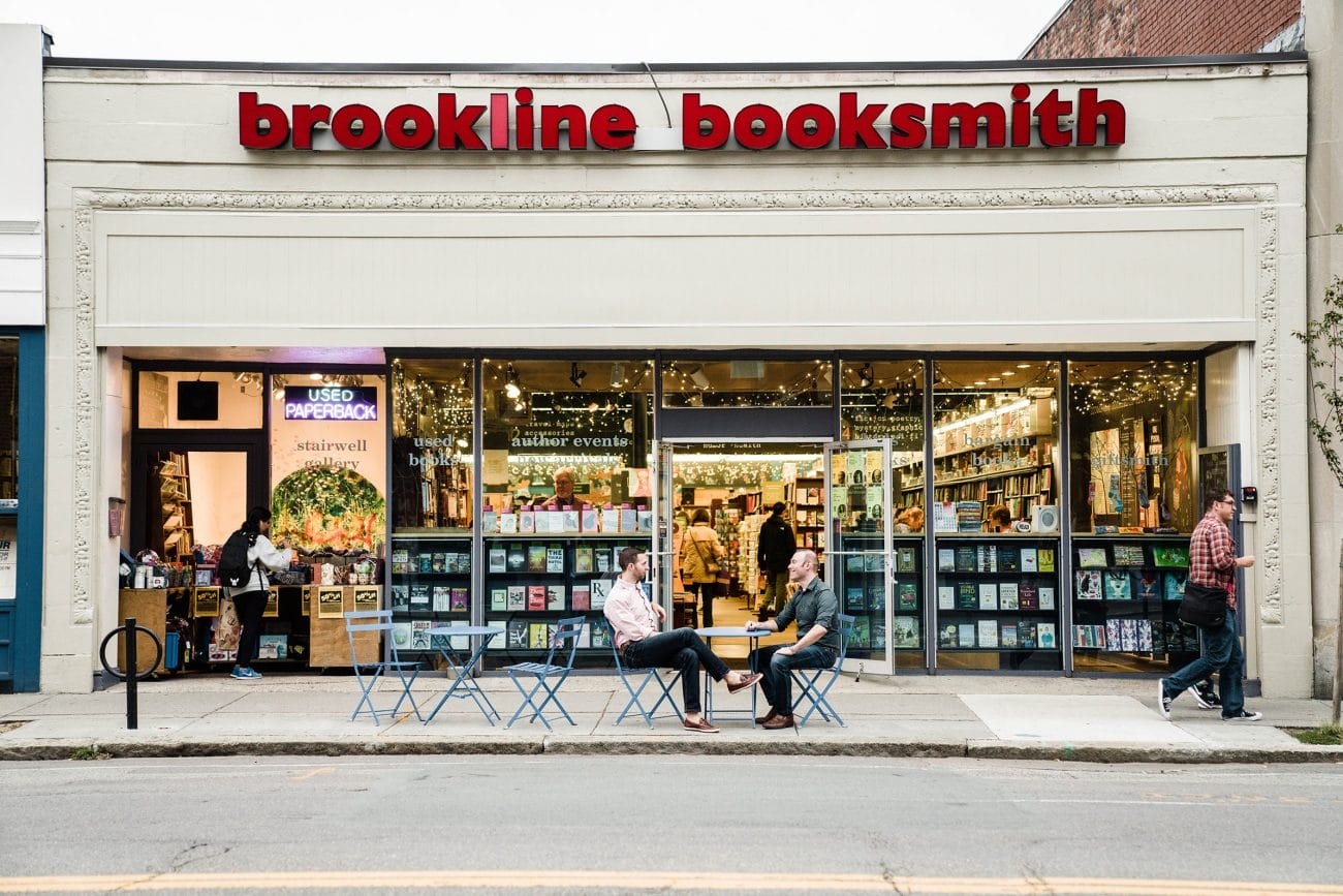 A documentary photograph of a couple at their favorite book store during their Boston engagement session
