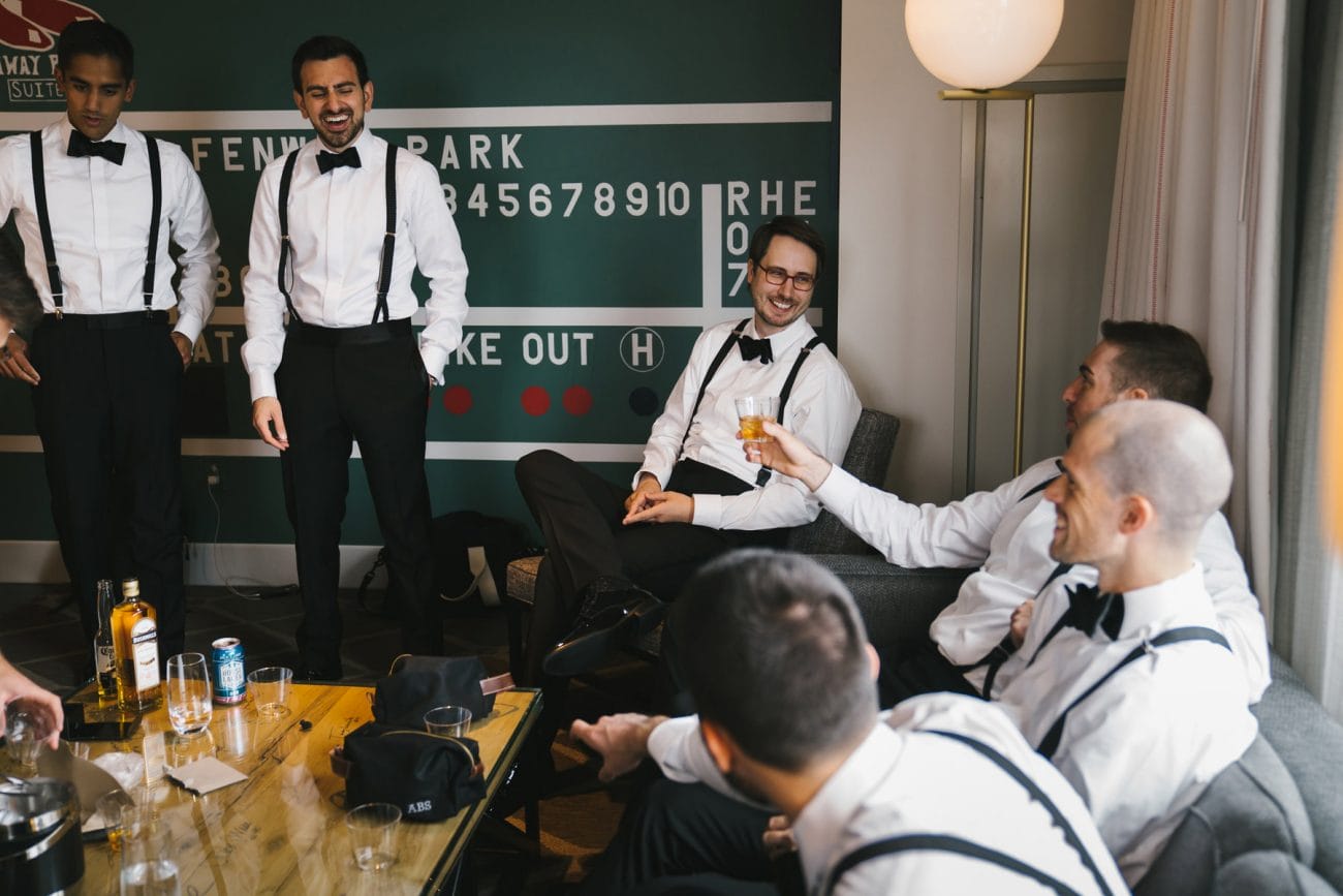 A best of Boston wedding photograph documenting groomsmen getting ready near Fenway park during their Boston Wedding at Hotel Commonwealth 