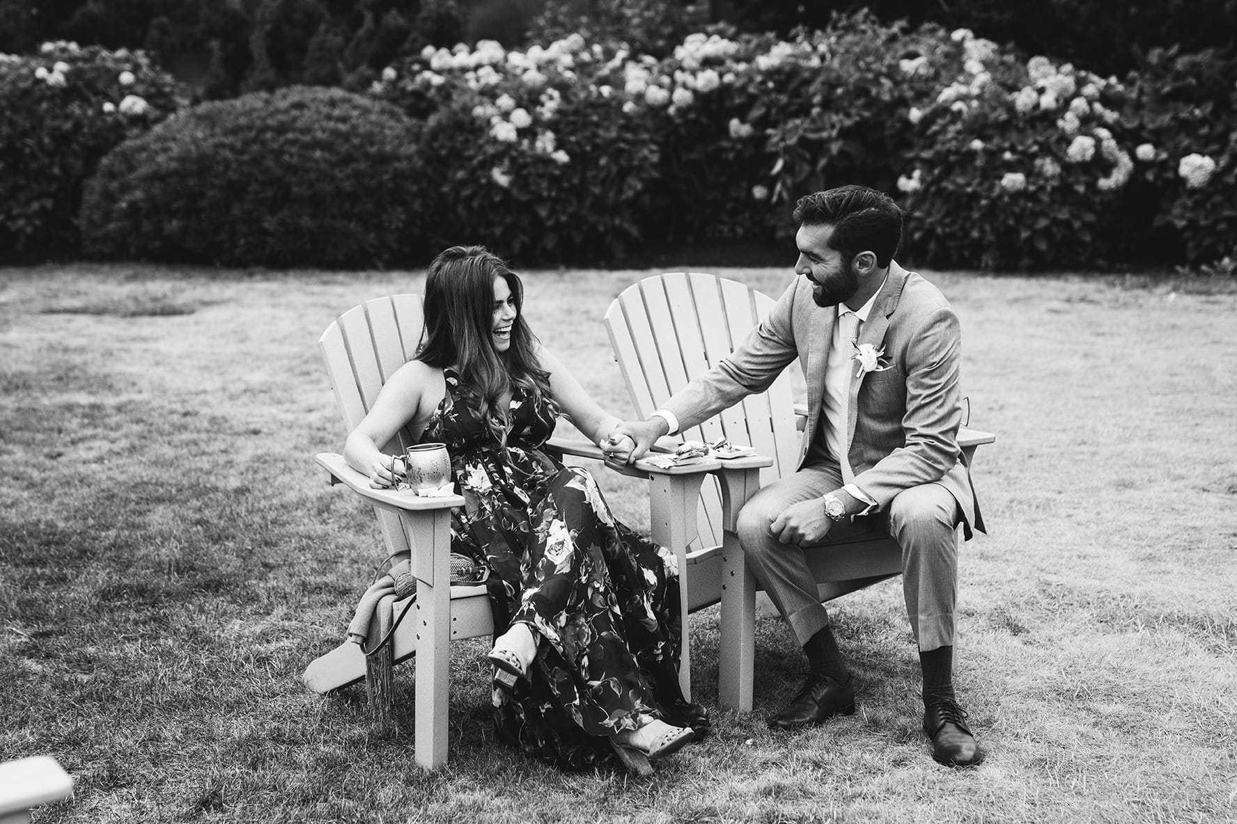 A best of Boston wedding photograph of a couple talking and laughing during a Castle Hill Inn wedding