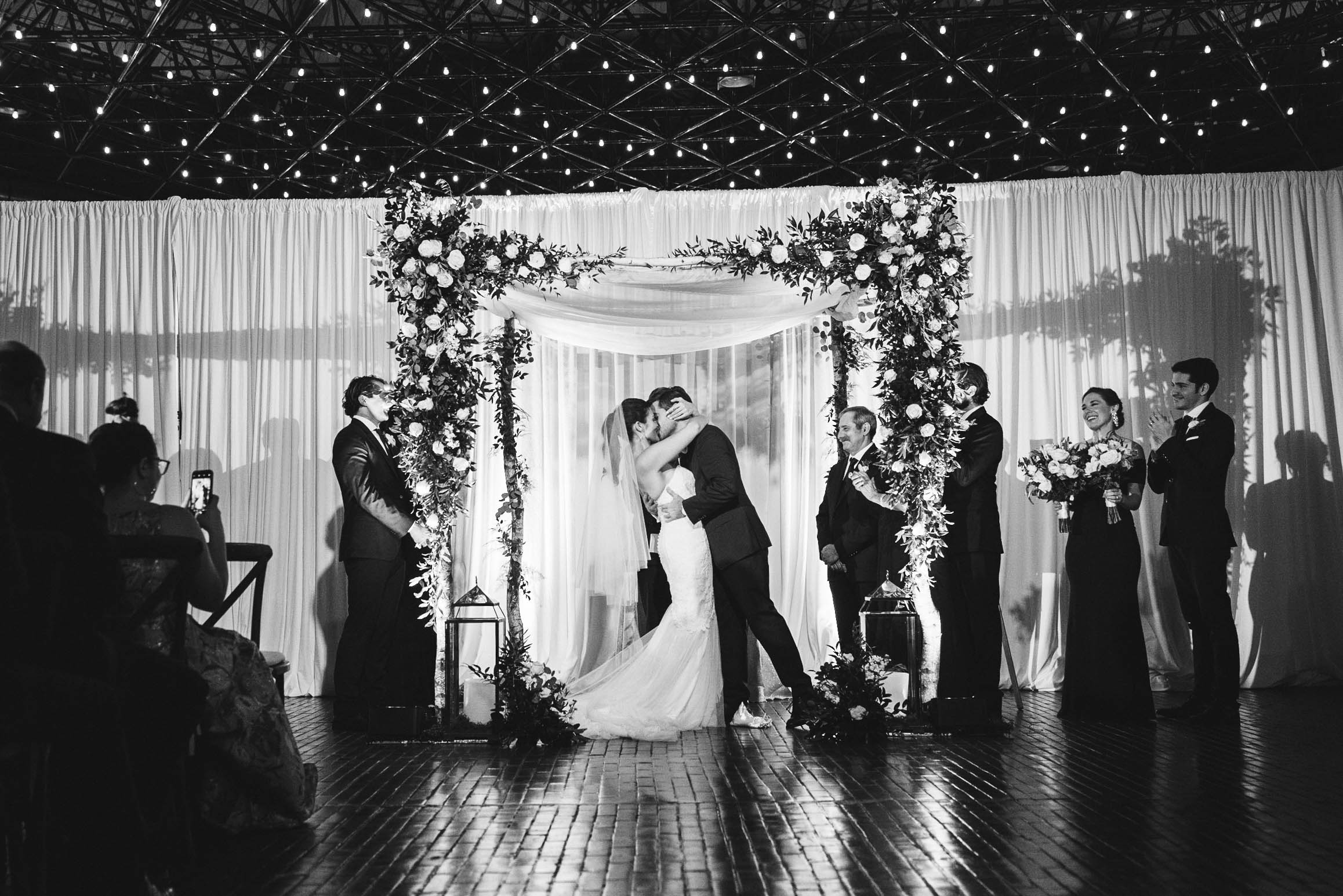 A best of Boston wedding photograph of a couple kissing during their jewish wedding ceremony at Cyclorama