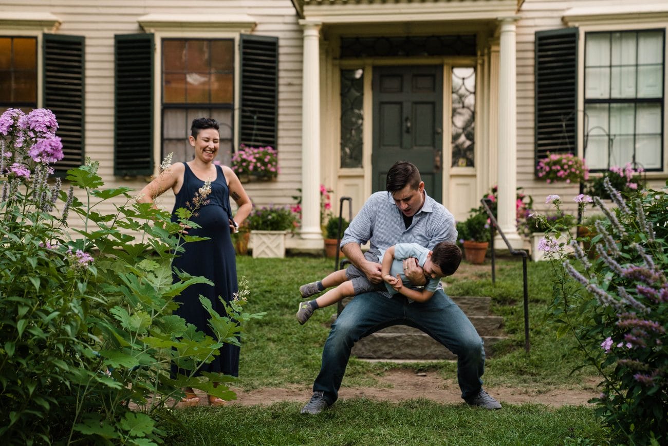 A best of Boston family photograph of a family playing and laughing during an in home family session in Boston