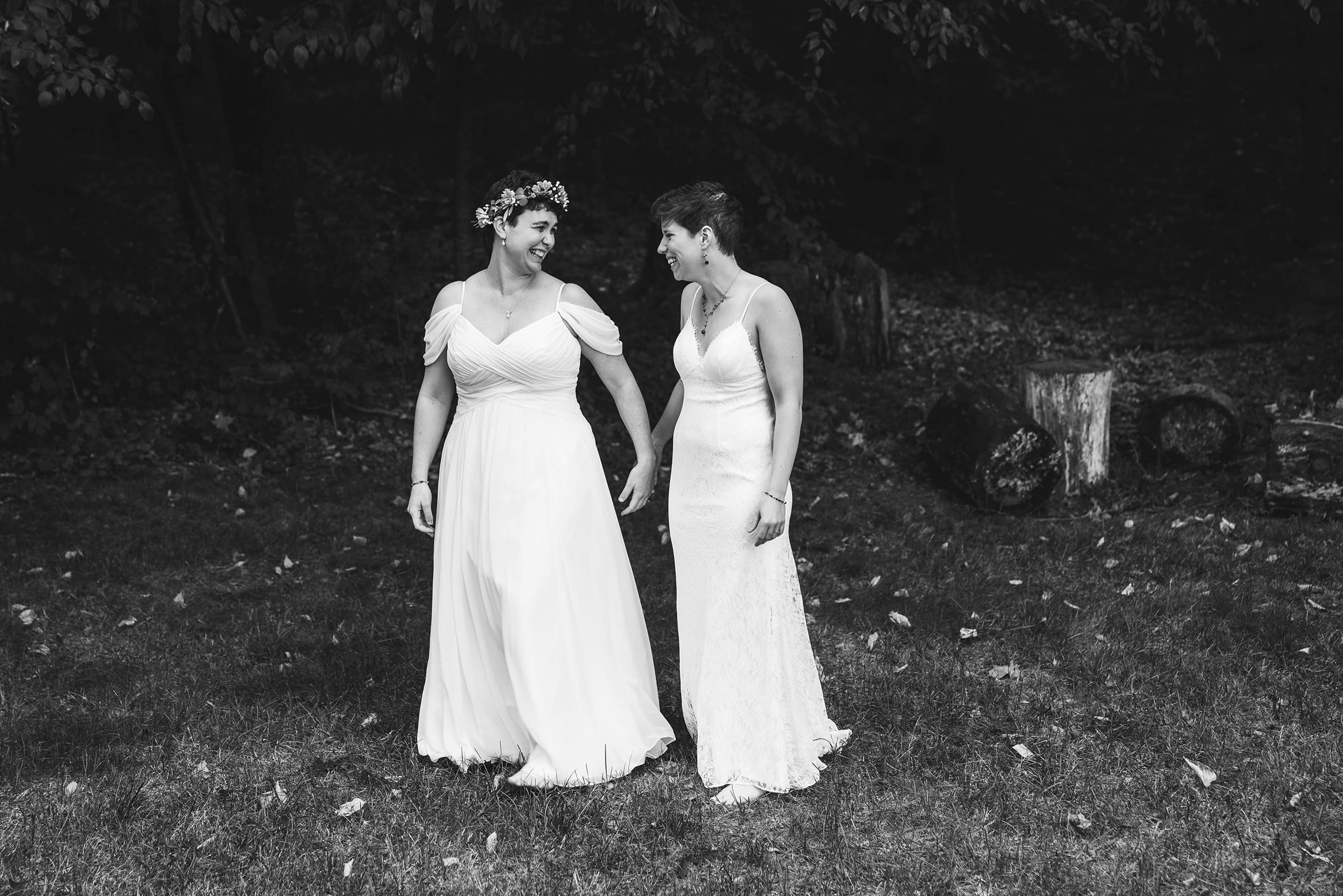 A best of Boston wedding photograph of a couple walking and laughing during their Friendly Crossways wedding outside of Boston