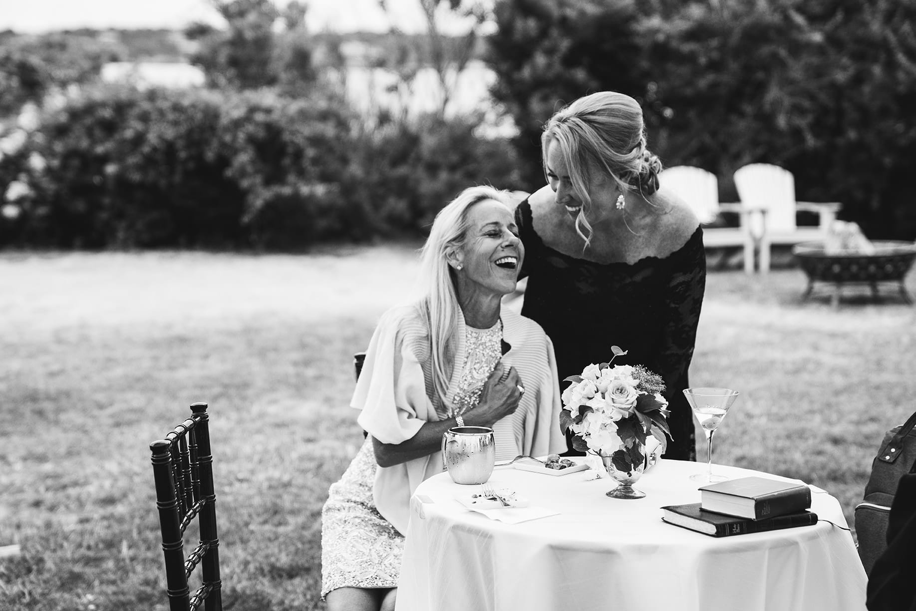 A best of Boston wedding photograph of wedding guests talking and laughing during a Castle Hill Inn wedding
