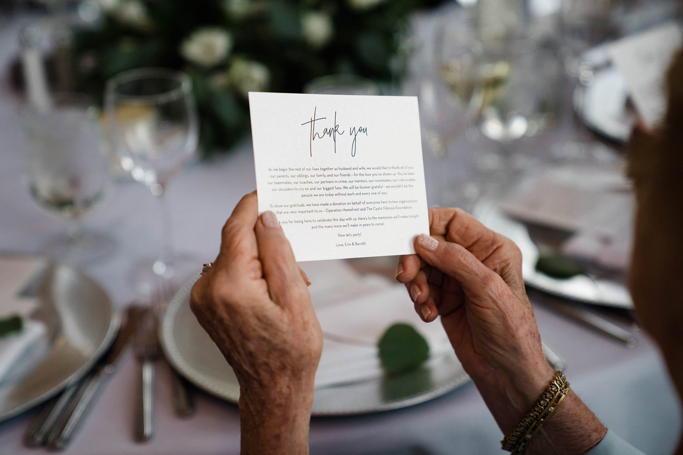 A best of Boston wedding photograph of a grandmother reading a thank you note at a State Room wedding in Boston