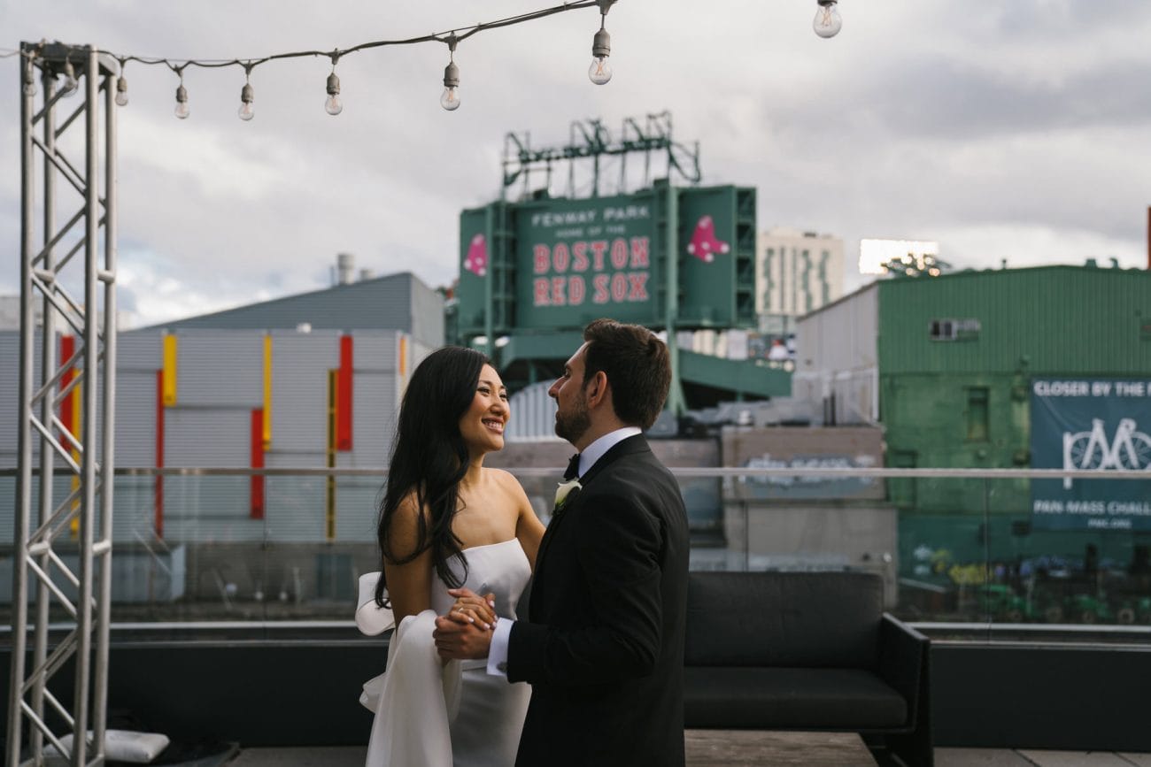 A best of Boston wedding photograph of a couple dancing outside Commonwealth Hotel near Fenway Park of Boston