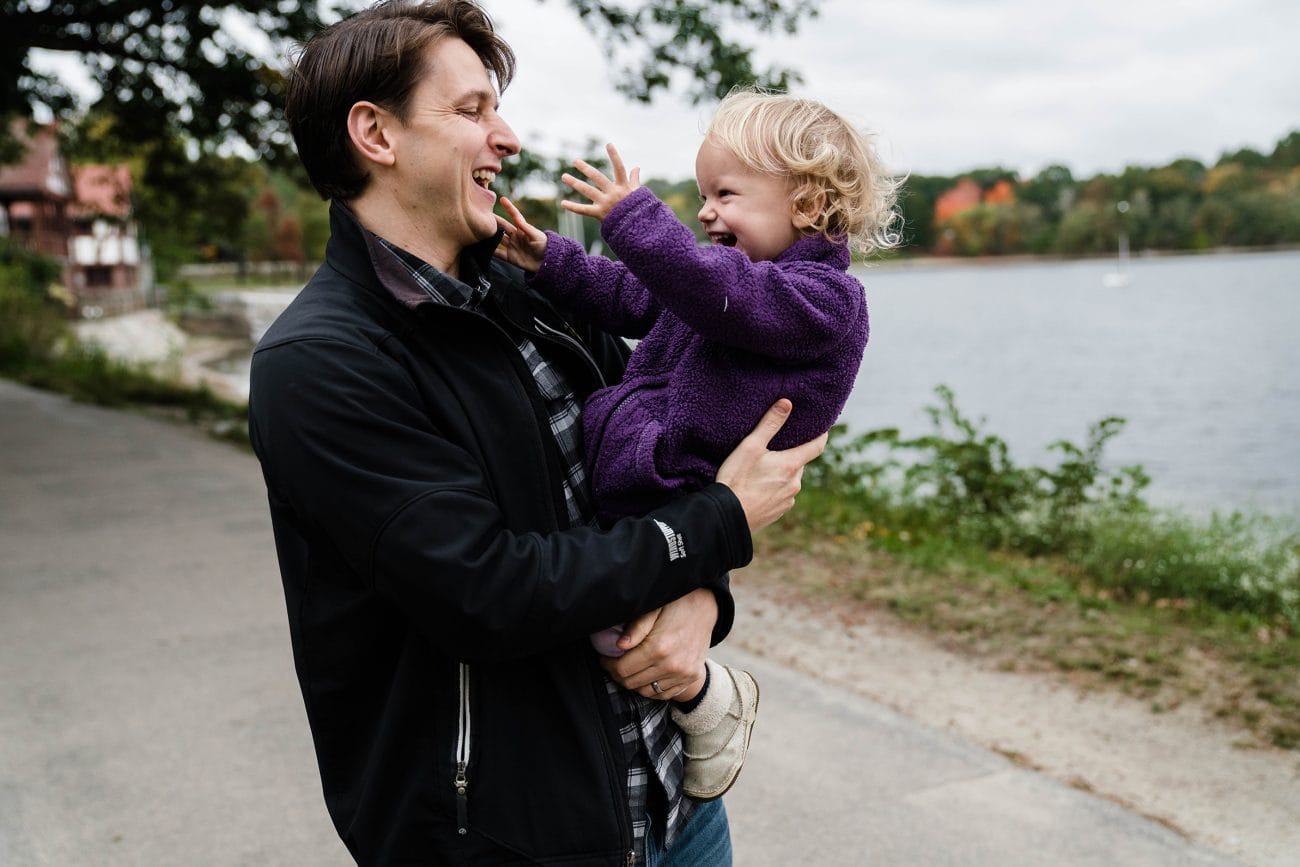 A best of Boston family photograph of dad playing with his daughter during their Jamaica pond family session in Boston