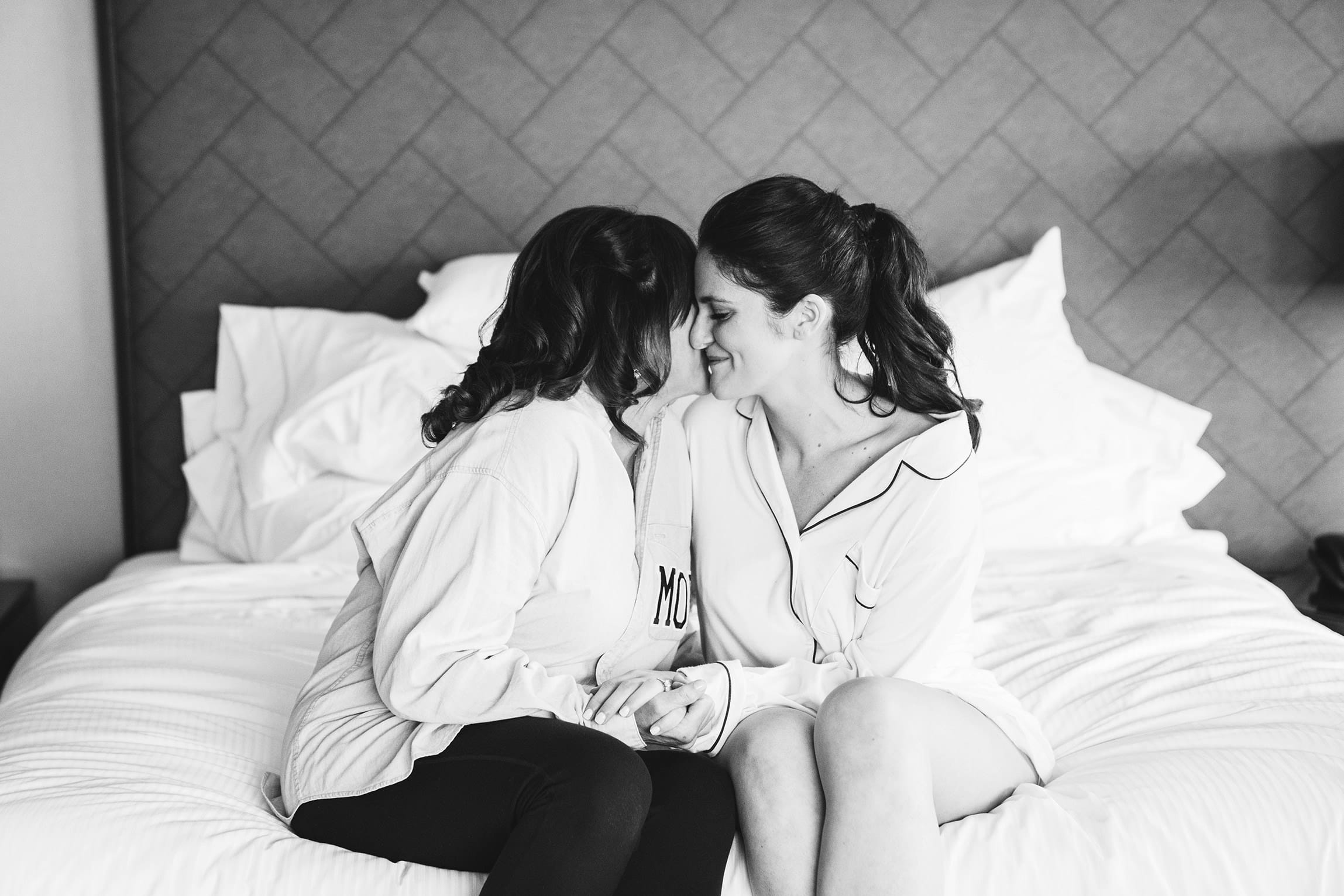 A best of Boston wedding photograph of a bride and her mother hugging and sharing a moment before her Cyclorama wedding in Boston