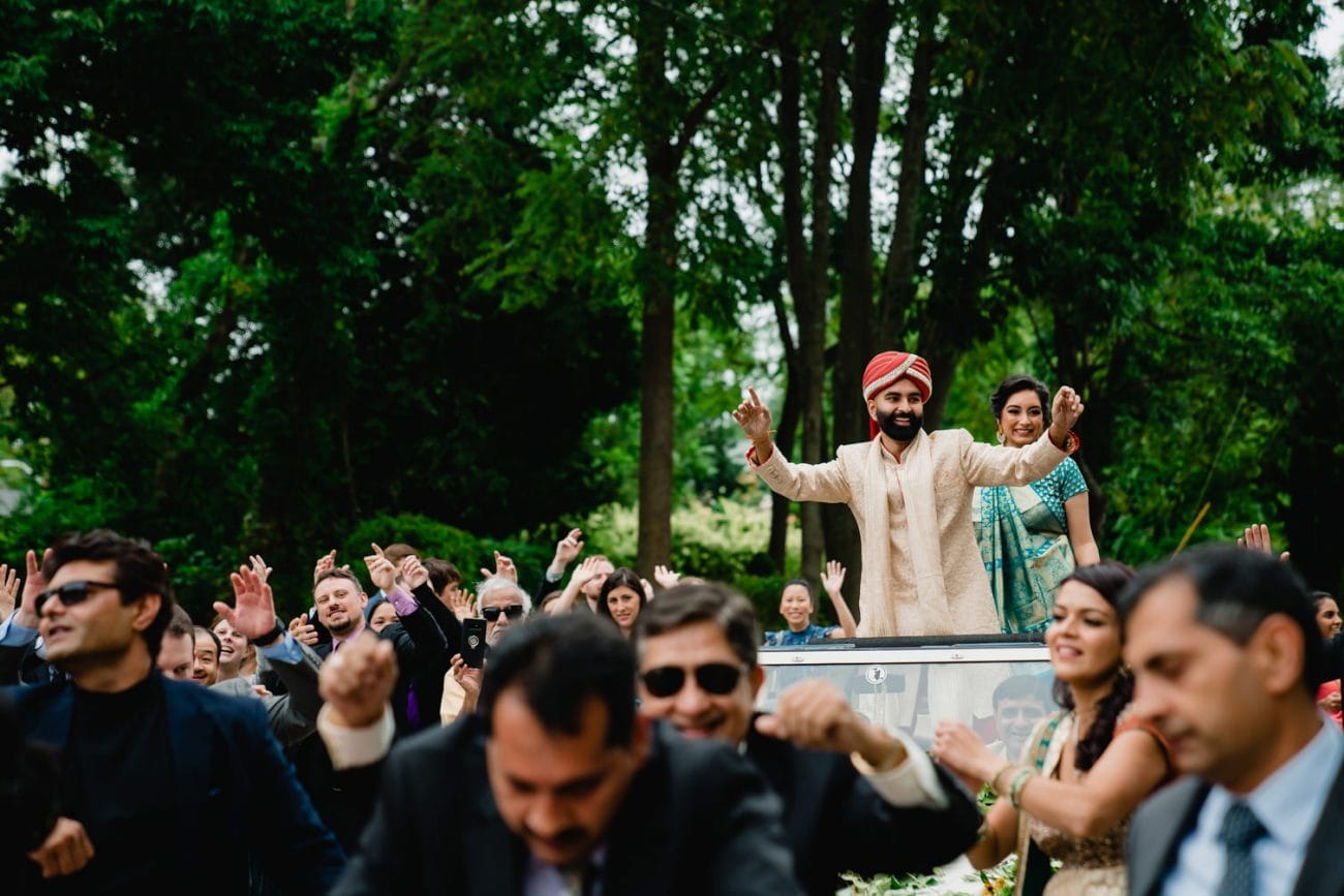 A best of Boston Wedding photograph of a groom dancing during his Baraat at an Indian American wedding in Providence, RI