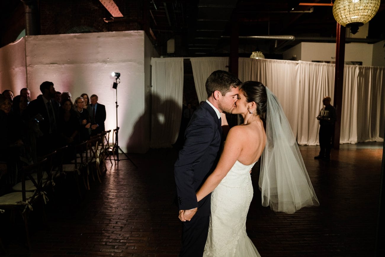 A best of Boston wedding photograph of couple kissing after their wedding ceremony at Cyclorama