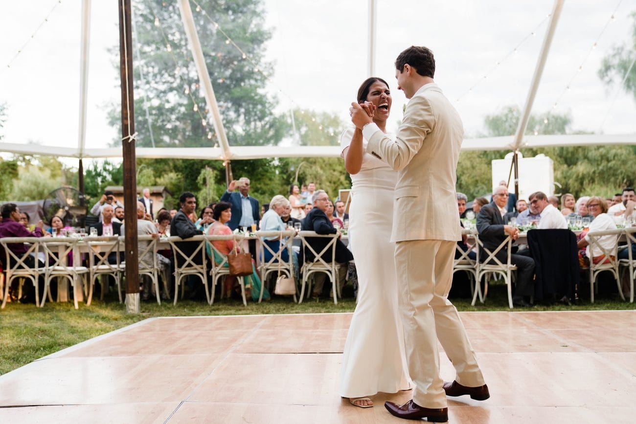 A documentary photograph featured in the best of wedding photography of 2019 showing a couple laughing during their first dance