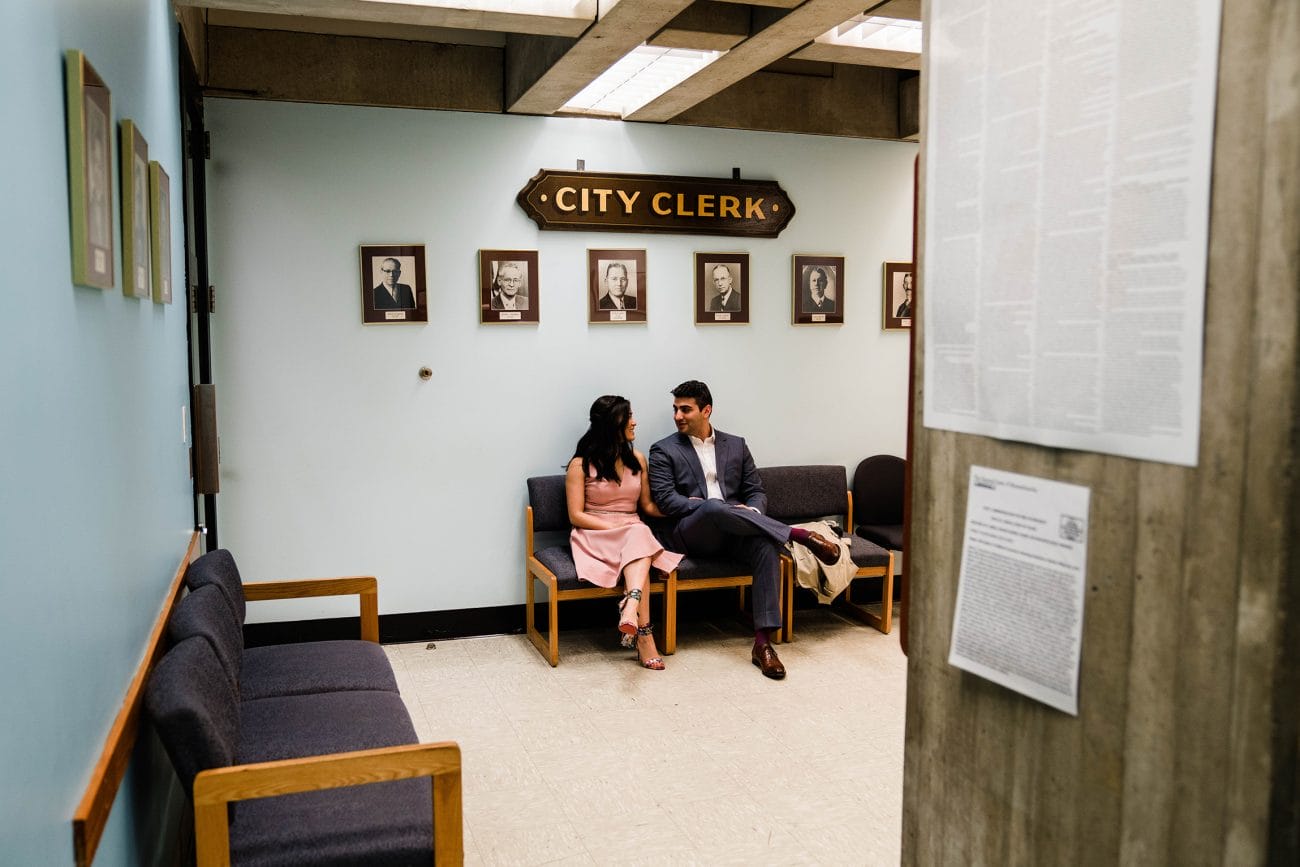 A documentary photograph featured in the best of wedding photography of 2019 showing a couple waiting for their city hall ceremony