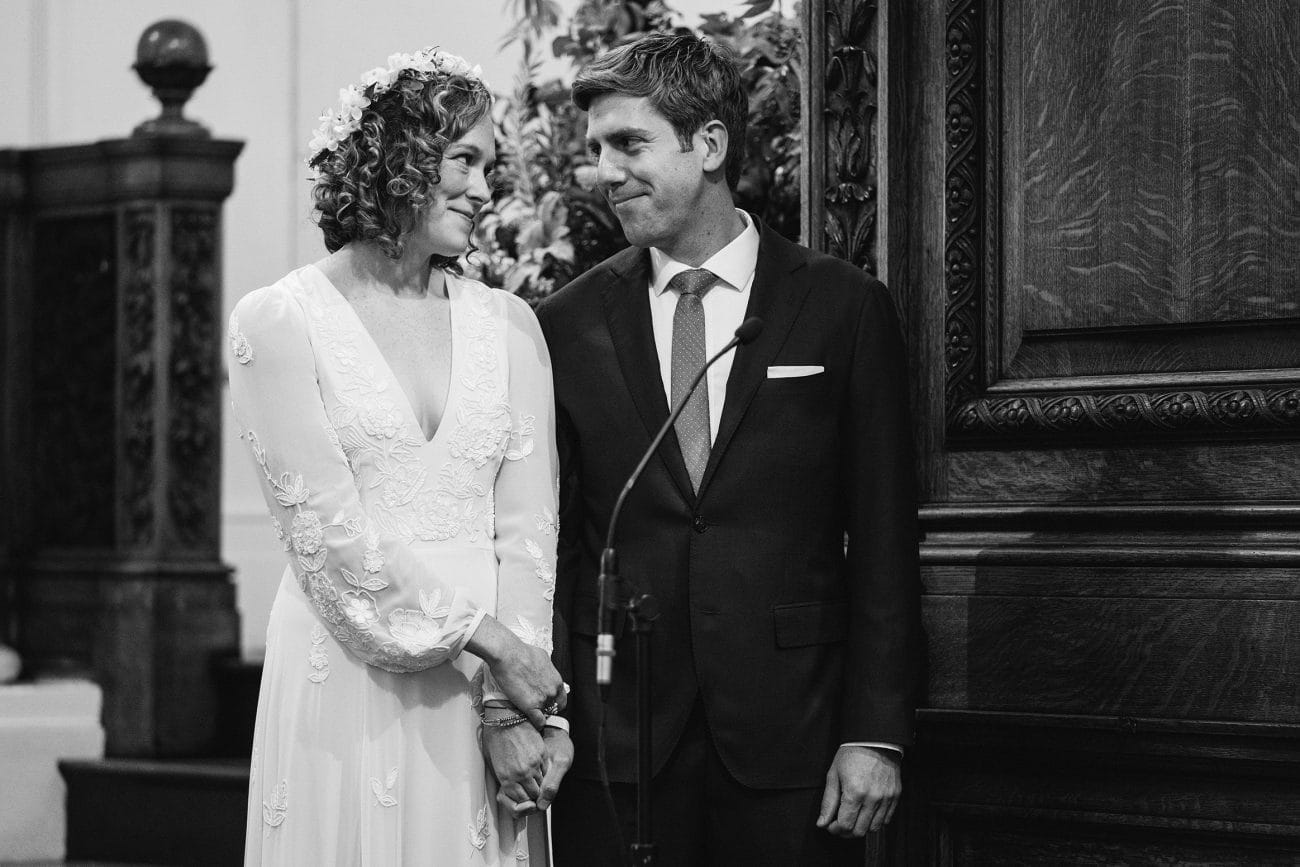 A documentary photograph featured in the best of wedding photography of 2019 showing a couple sharing a smile during their wedding ceremony