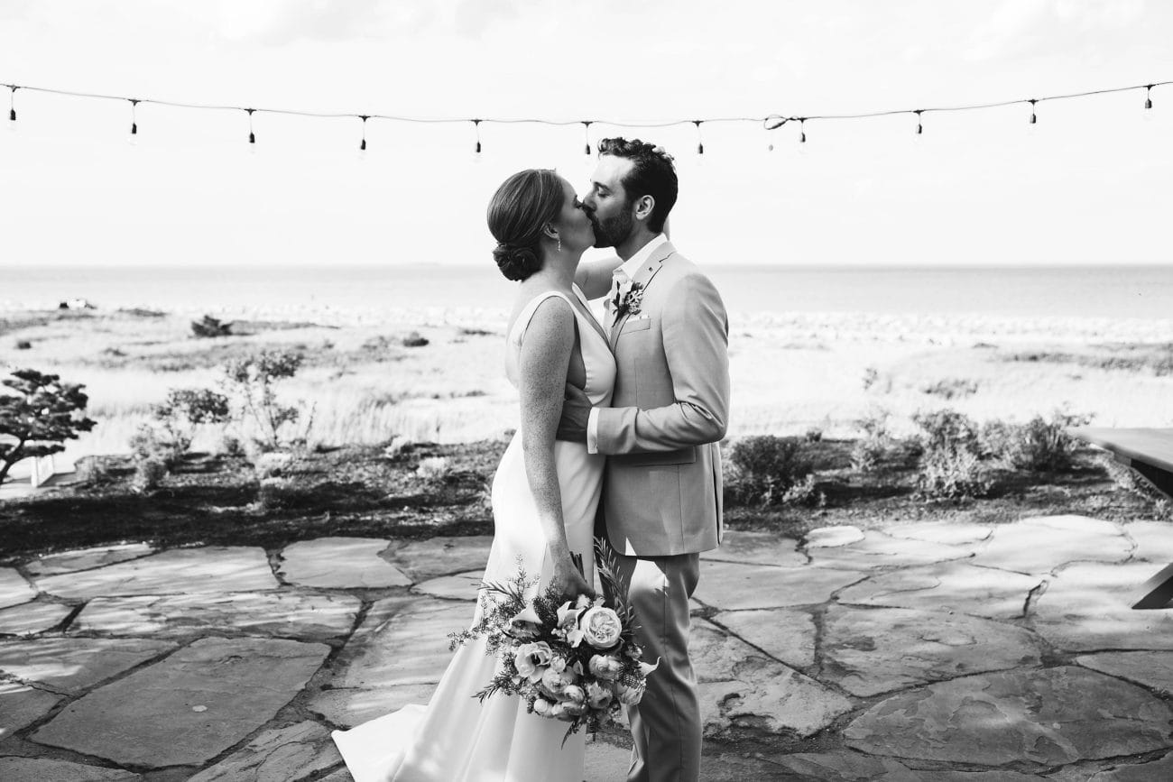 A documentary photograph featured in the best of wedding photography of 2019 showing a couple sharing an intimate kiss